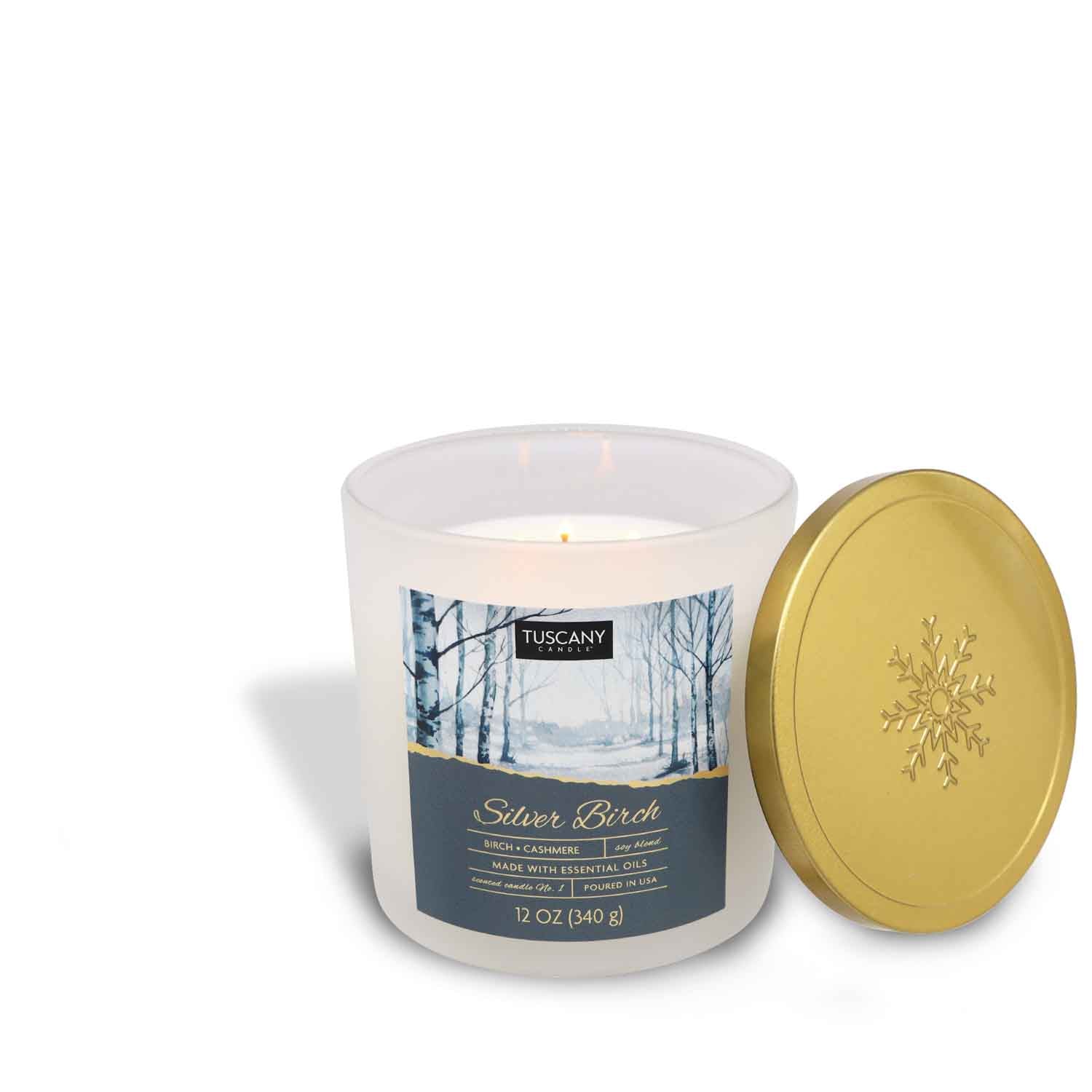 12oz Silver Birch scented candle in a frosted glass jar with a golden lid, filled with white wax, radiating aromas of white winter birch, cashmere, and vanilla from the Christmas candle collection.