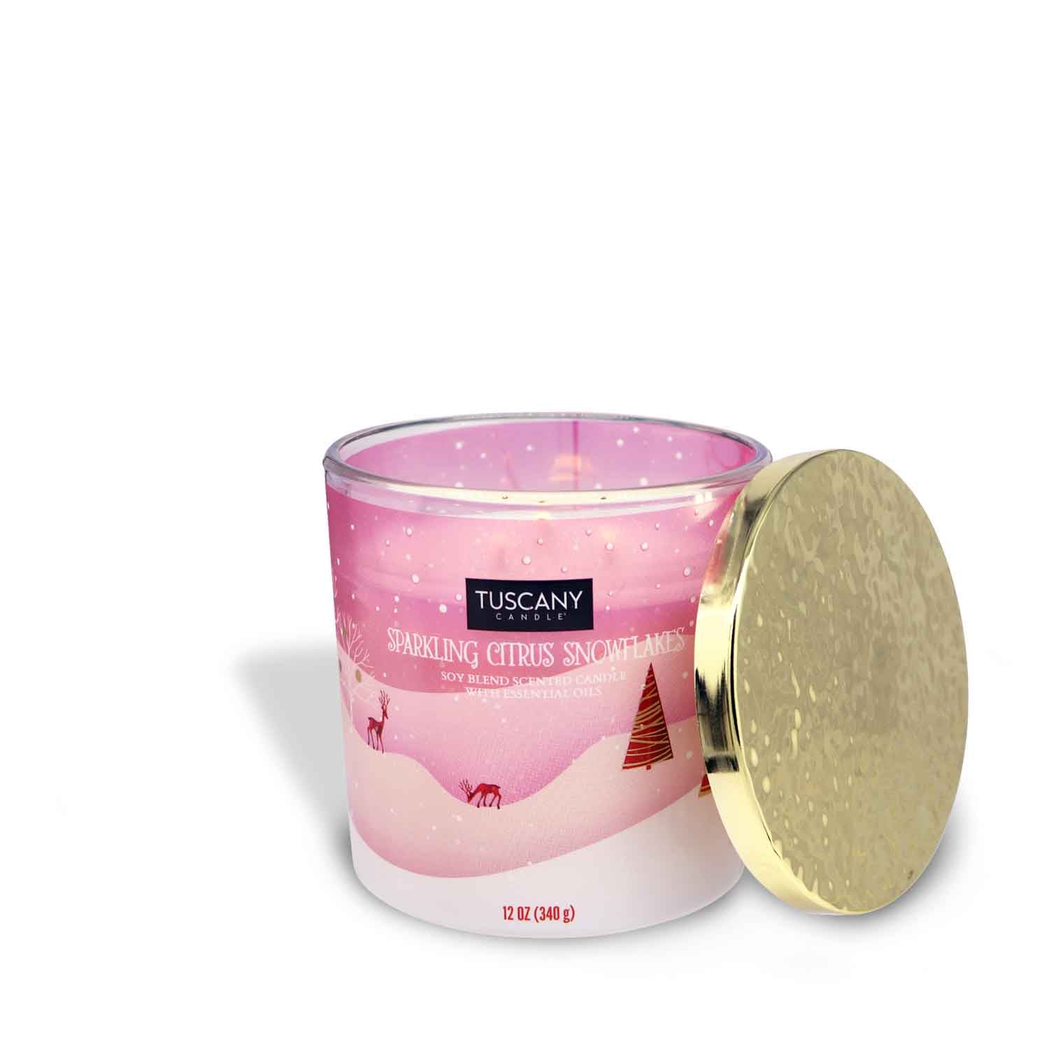 12oz Sparkling Citrus Snowflakes scented candle in a decorative glass jar with a gold lid, filled with white wax, releasing scents of winter citrus breeze and delicate snowflakes from the Christmas candle collection.