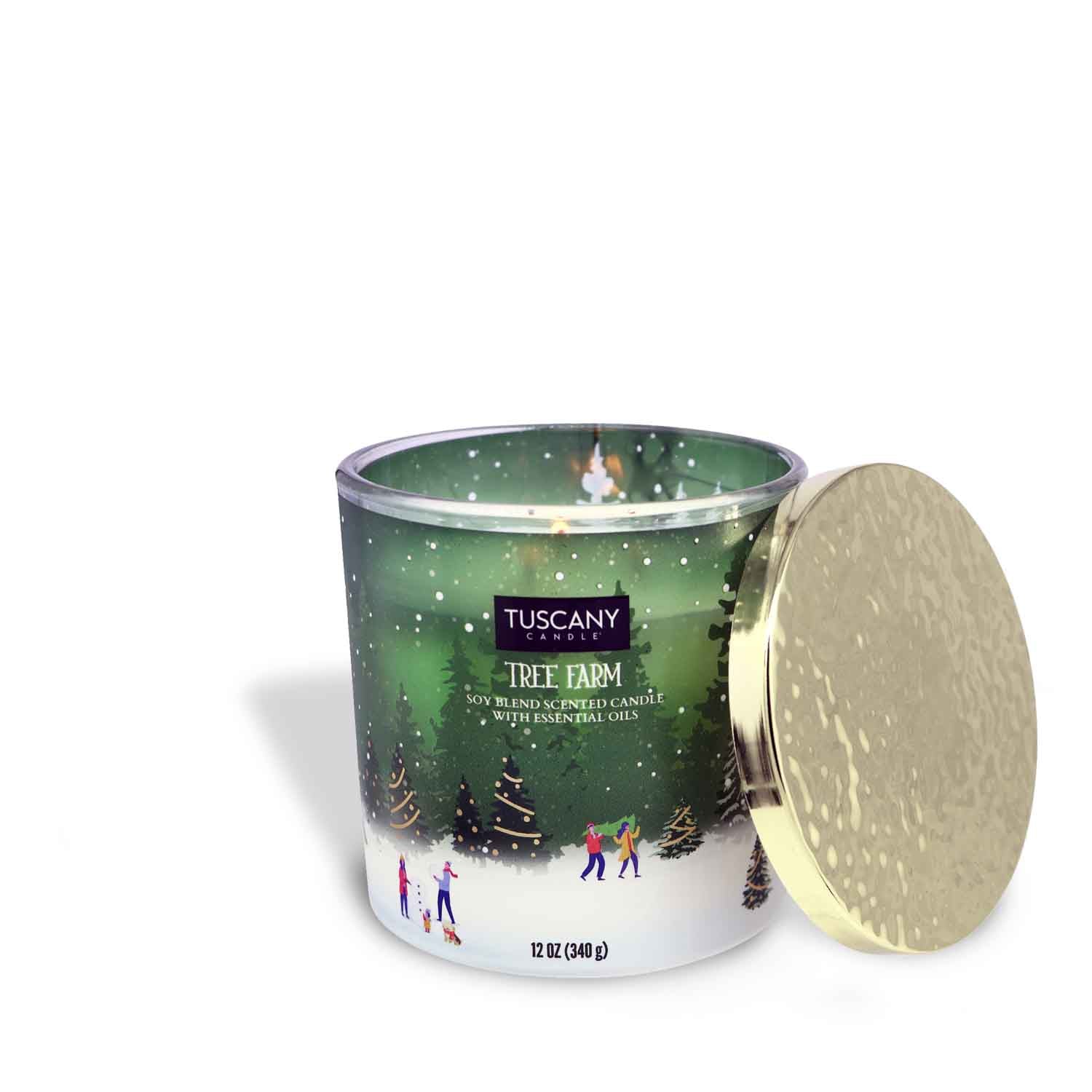 Tree Farm scented candle from the Winter Park collection, housed in a decorative glass jar with a golden lid, displayed against a white backdrop.