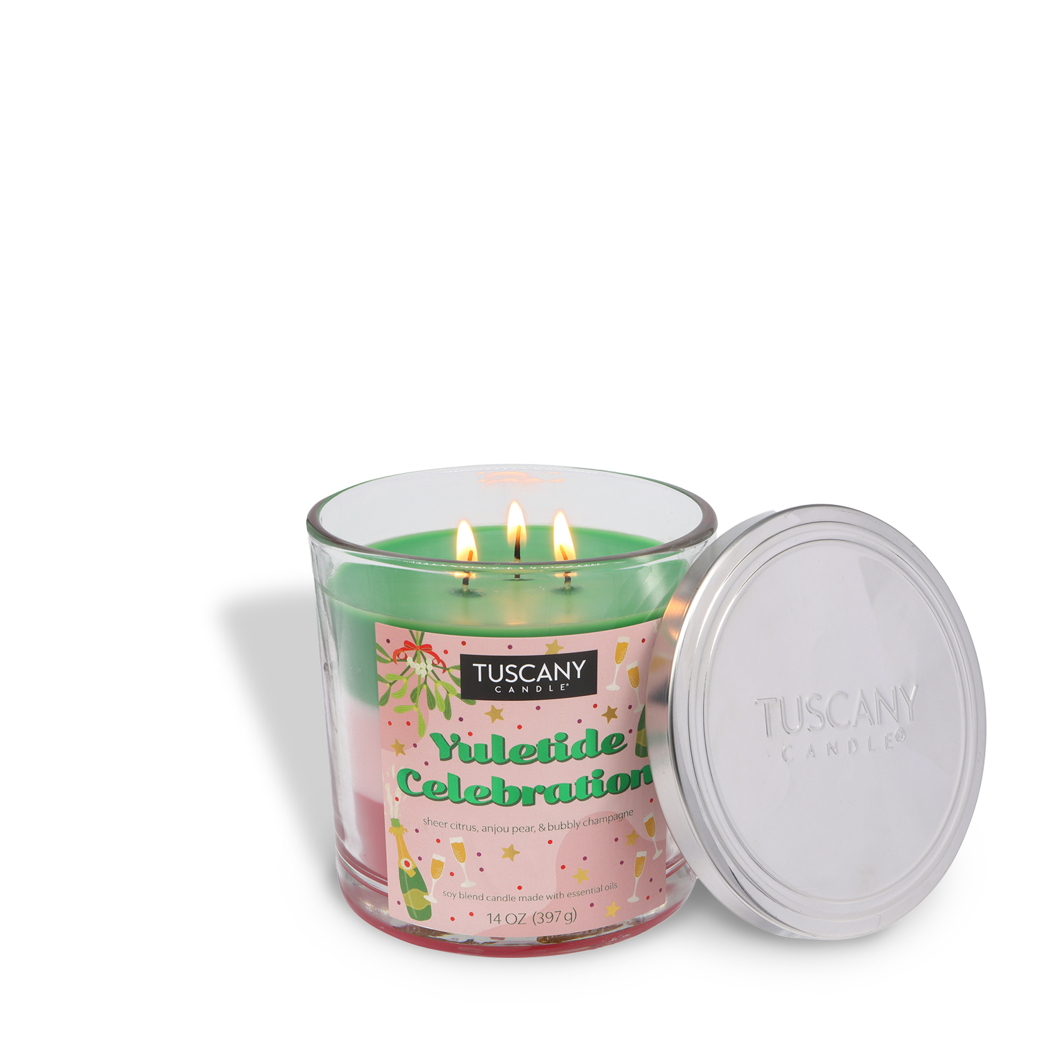A green, three-wick "Yuletide Celebration" scented holiday candle (14 oz) by Tuscany Candle® SEASONAL, in a clear glass jar with a silver lid set to the side.