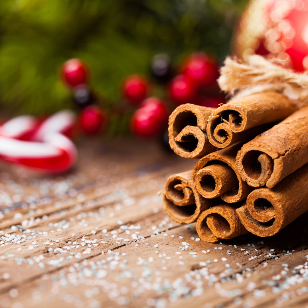 A still life of cinnamon and christmas spices - the inspiration for our "Spiced Cinnamon" Christmas Candle