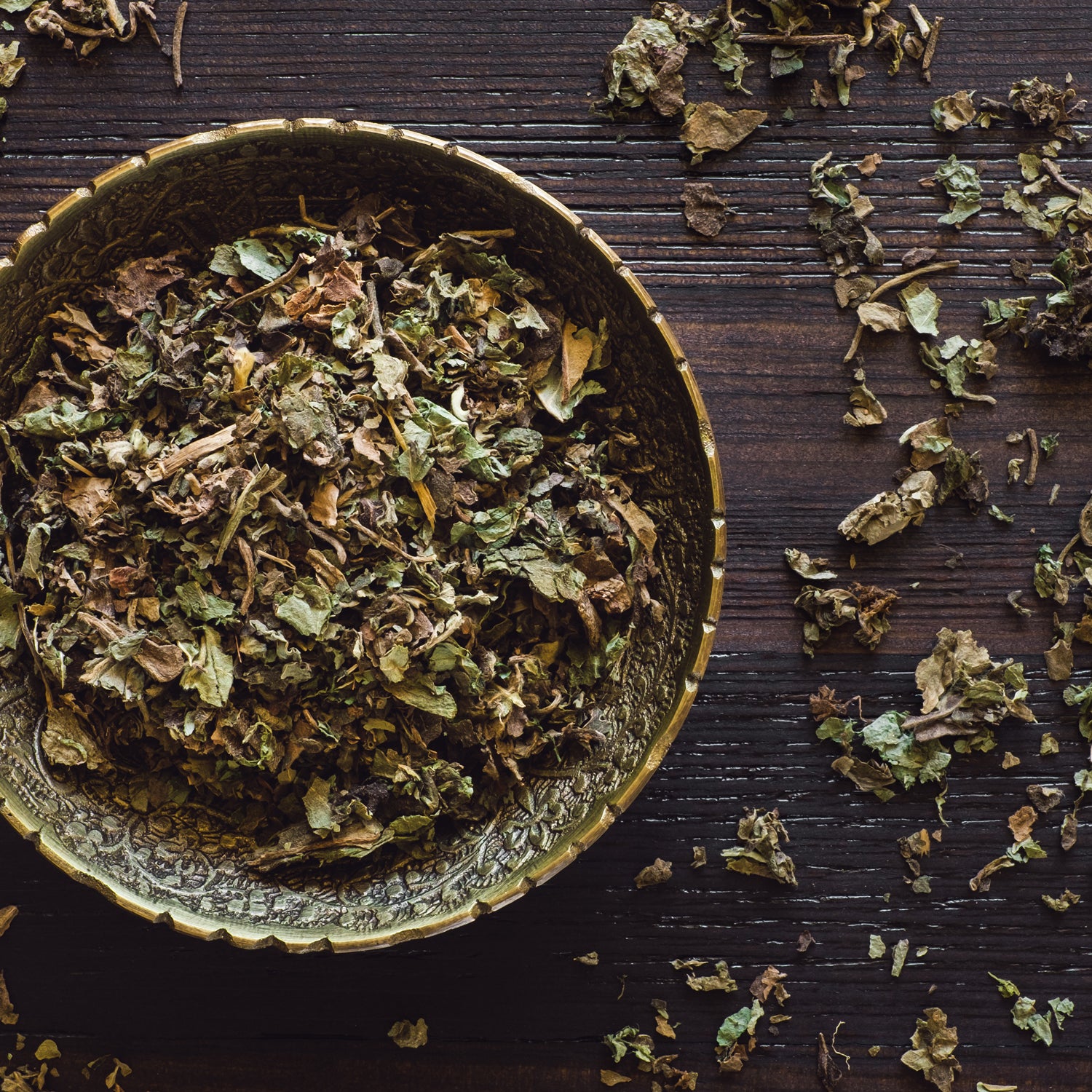 A photo of some of the components of the masculine incense fragrance notes in the "Amber Oud" scented candle from Tuscany candle