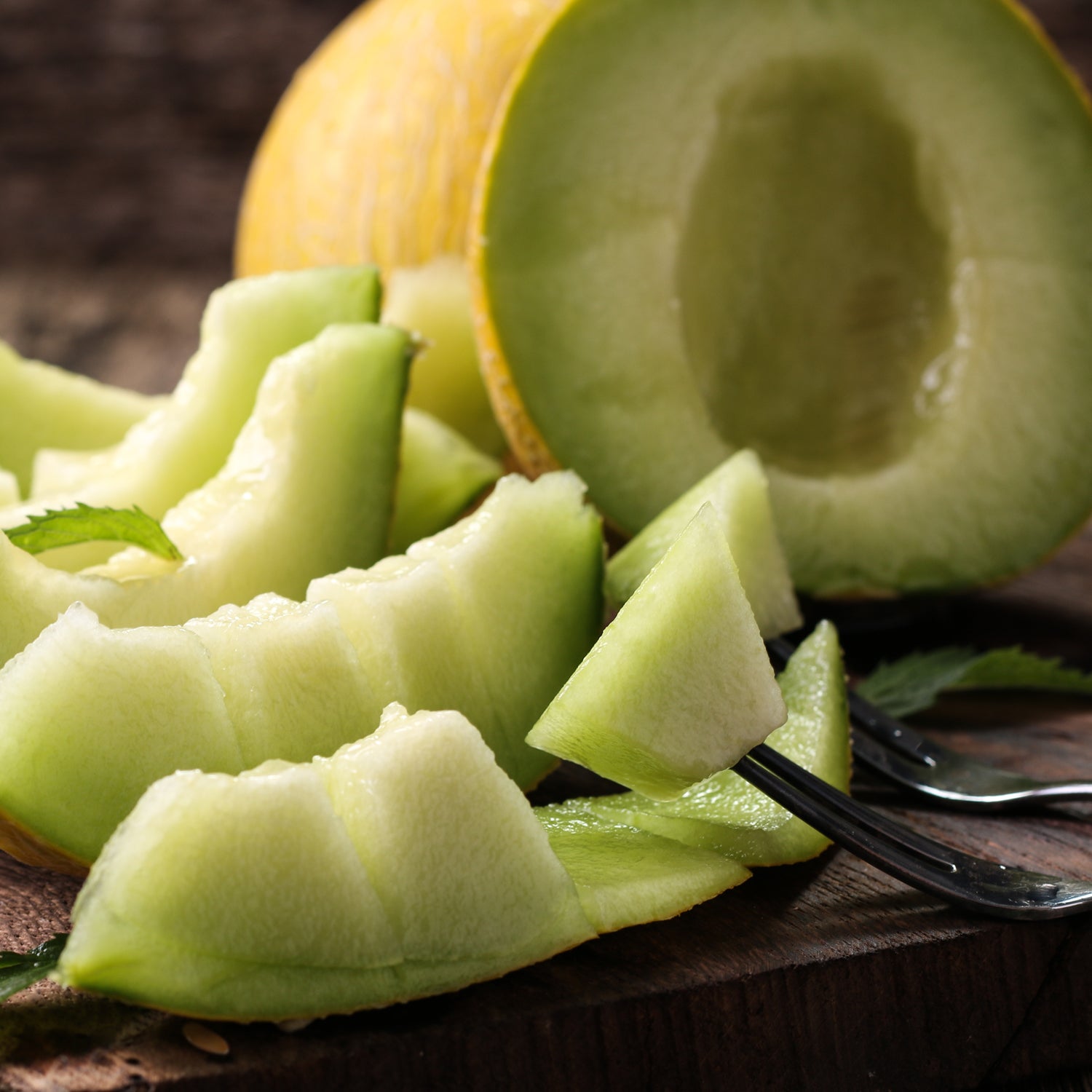 A slice of Hawaiian Breeze Long-Lasting Scented Jar Candle (18 oz) on a cutting board, bringing a taste of tropical paradise.