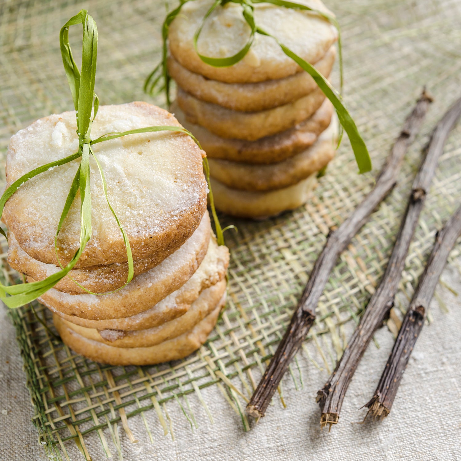 Lemon Sugar cookies are stacked on a table - inspiration for this cookie-scented candle