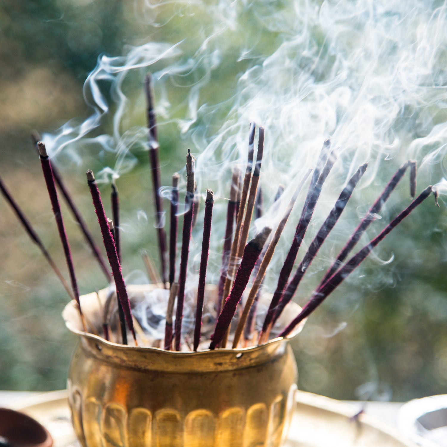 A photo of sandalwood incense being burned. This scent is on of the primary note in the "Tea Tree and Sandalwood" scented candle from Tuscany Candle.