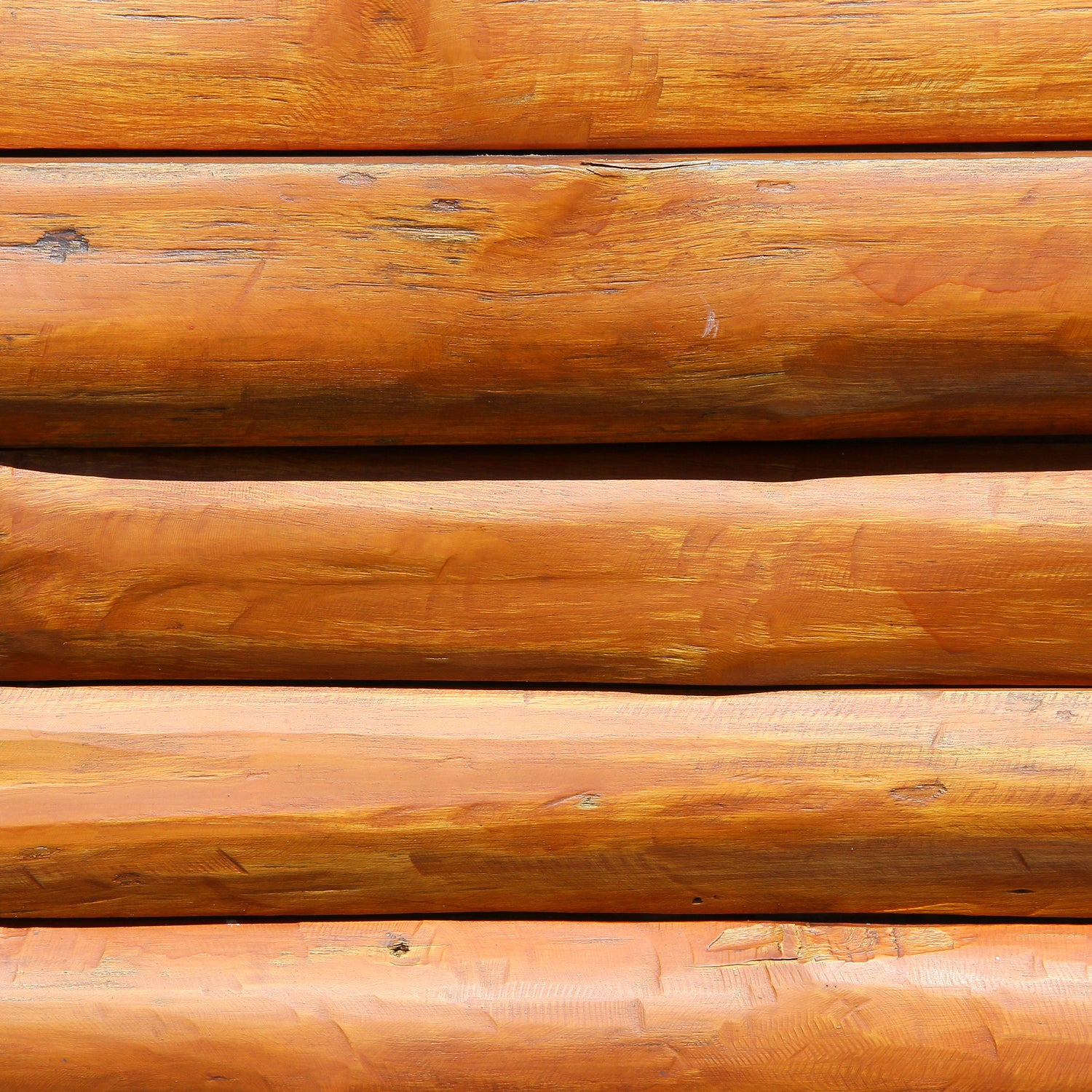 A still life of teakwood, one of the inspirations for our Mahogany Suede scented wax melt bar