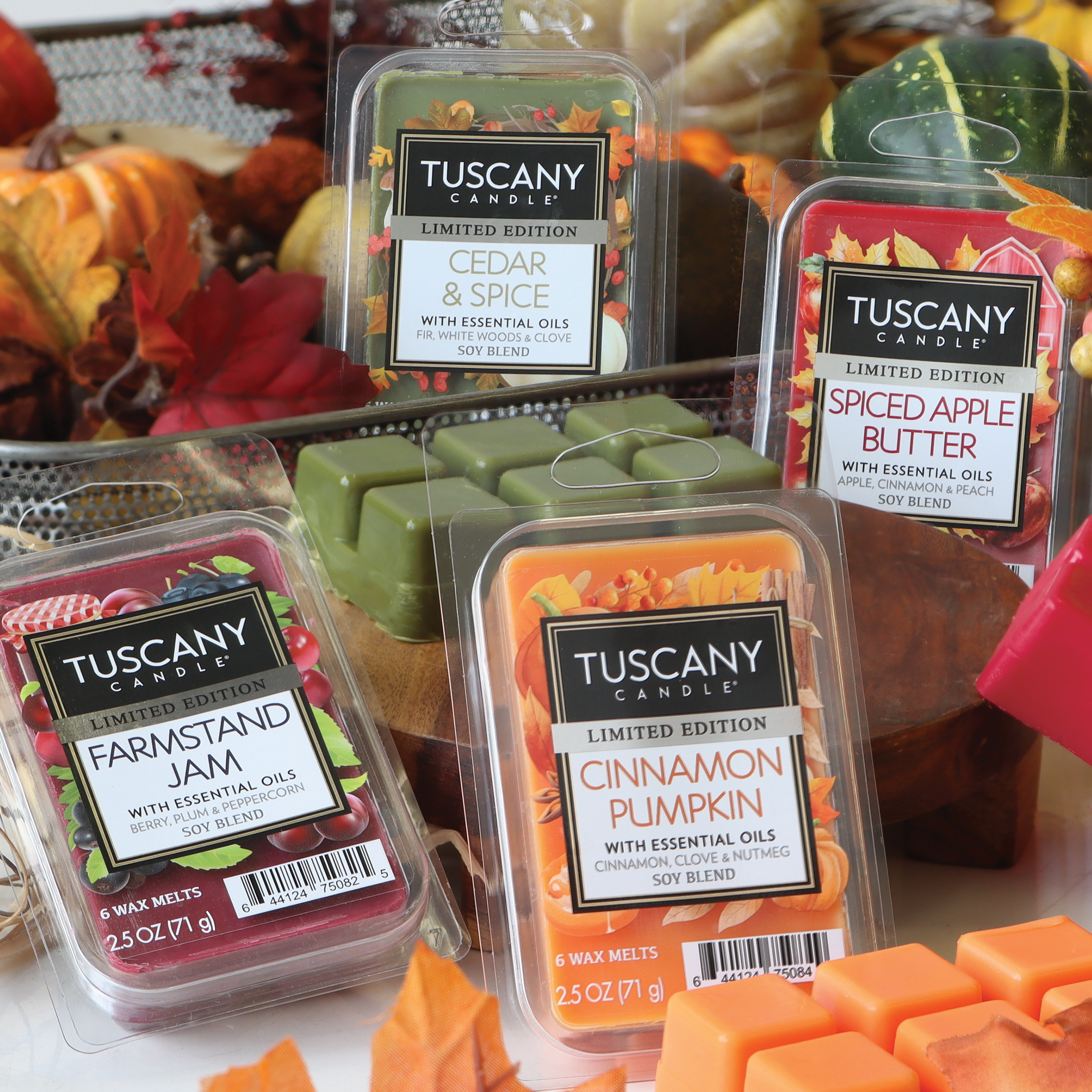 A selection of four Tuscany Candle® SEASONAL wax melts, each labeled Limited Edition, in various scents: Farmstand Jam Scented Wax Melt (2.5 oz), Cedar & Spice, Cinnamon Pumpkin, and Spiced Apple Butter.