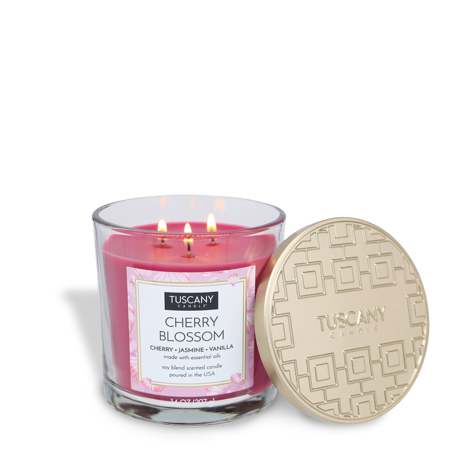 A lit Tuscany Candle® EVD Cherry Blossom Long-Lasting Scented Jar Candle (14 oz), labeled "Cherry Blossom" and topped with a gold-patterned lid, fills the air with a delicate floral fragrance.