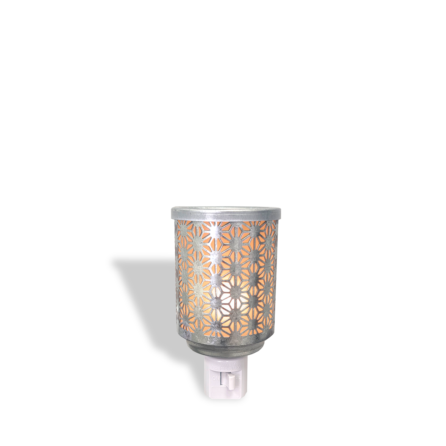 The Tuscany Candle® Everyday Galvanized Metal Wax Melt Warmer features a cut-out floral pattern on its metal cover and emits a warm glow when plugged in.
