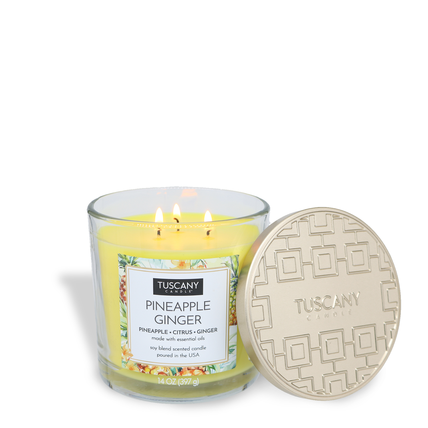 A lit Pineapple Ginger Long-Lasting Scented Jar Candle (14 oz) by Tuscany Candle® EVD sits next to its beige patterned lid in a clear glass jar, filling the air with its refreshing fragrance.