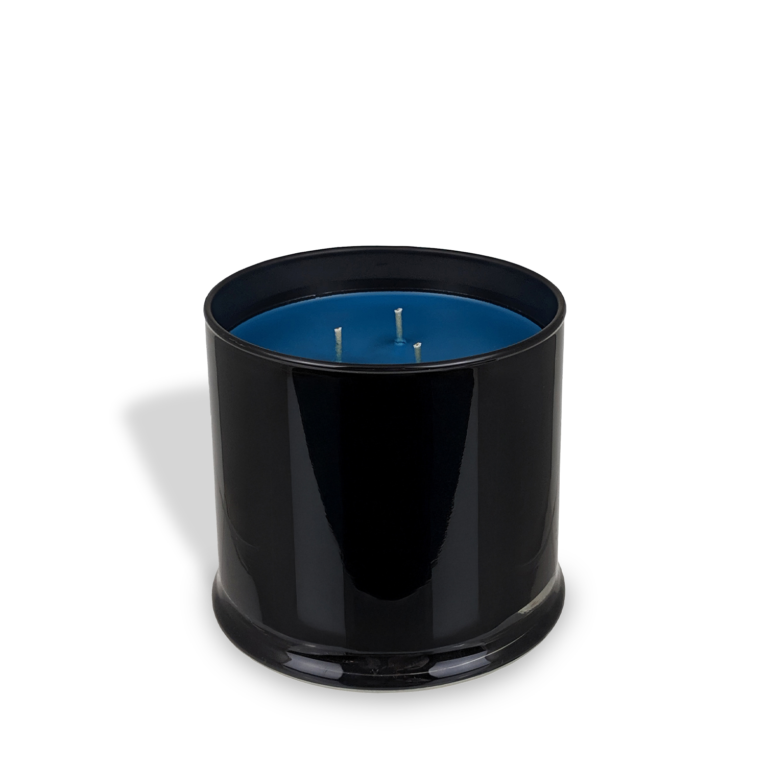 The Tuscany Candle® EVD Woodland Waterfall Scented Jar Candle (15 oz) from the Homme + Heritage Collection features blue wax and three wicks in a black cylindrical jar, displayed against a white background.