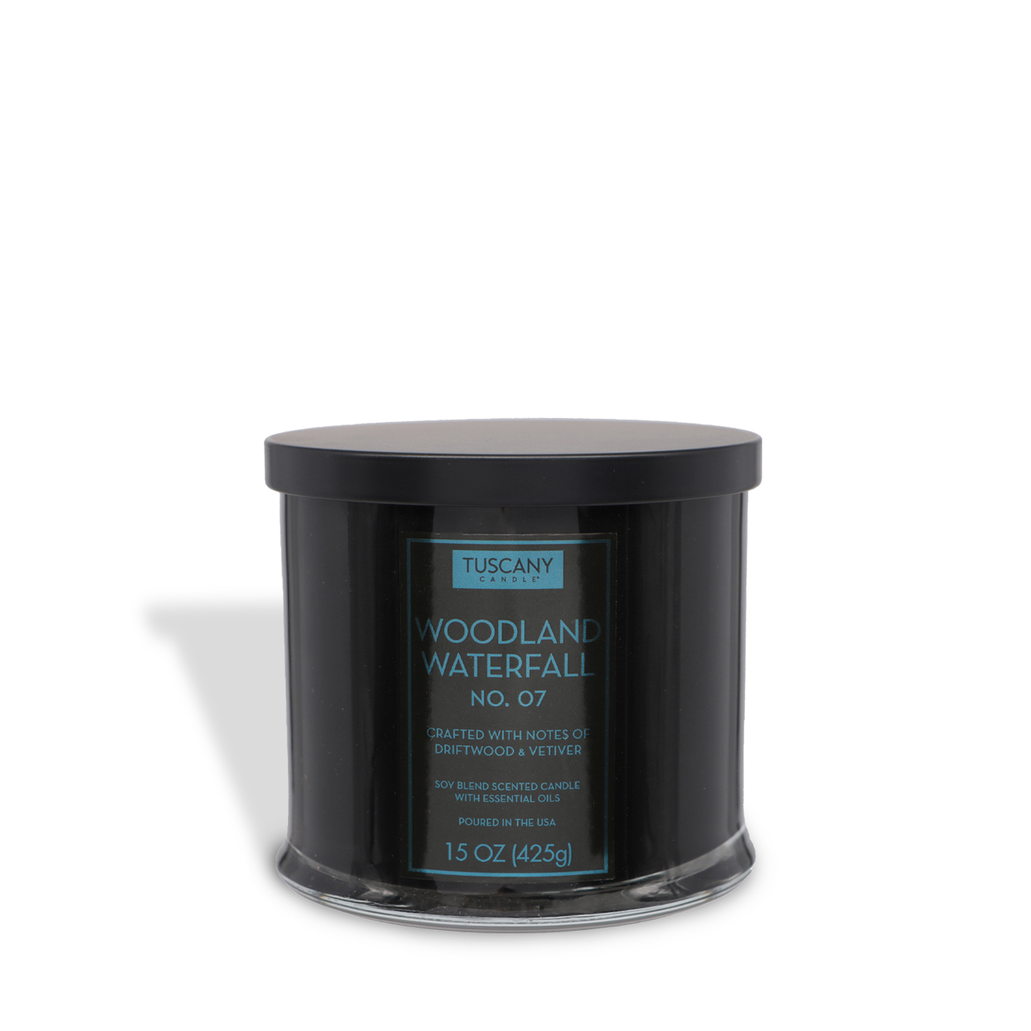 The Woodland Waterfall Scented Jar Candle (15 oz) from Tuscany Candle® EVD’s Homme + Heritage Collection features masculine notes of driftwood and vetiver, comes in black with a sleek lid, and is labeled "Woodland Waterfall No. 07.