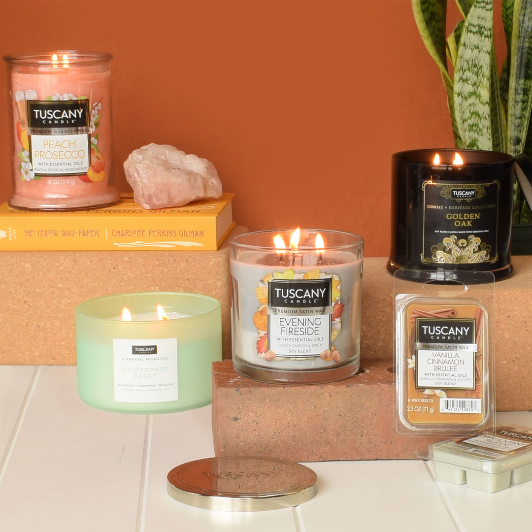 A group of scented candles are shown together in a still life