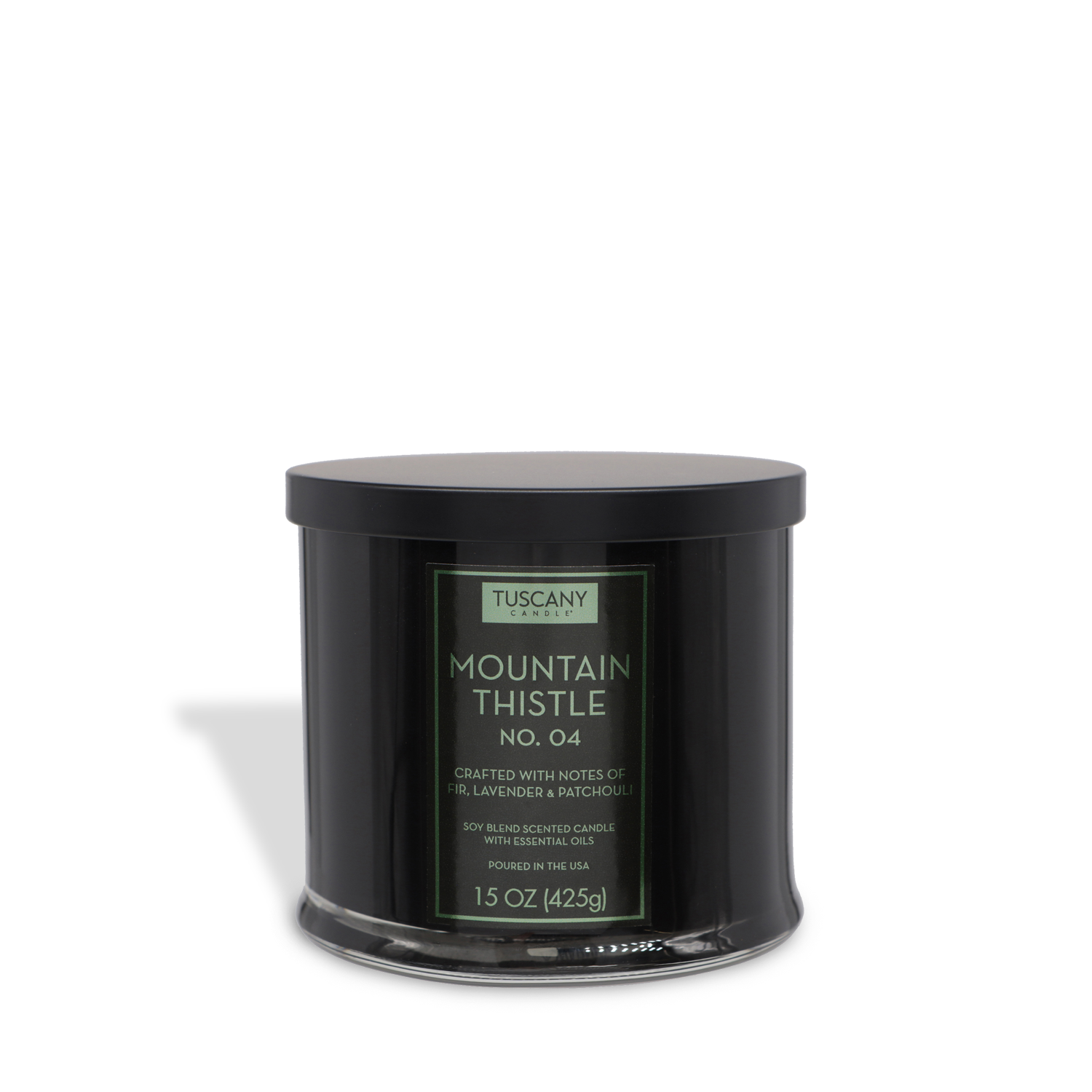 The Mountain Thistle Scented Jar Candle (15 oz) from the Tuscany Candle® EVD Homme + Heritage Collection is a black, round candle with a flat lid, featuring iris, fir needle, lavender, and patchouli notes.