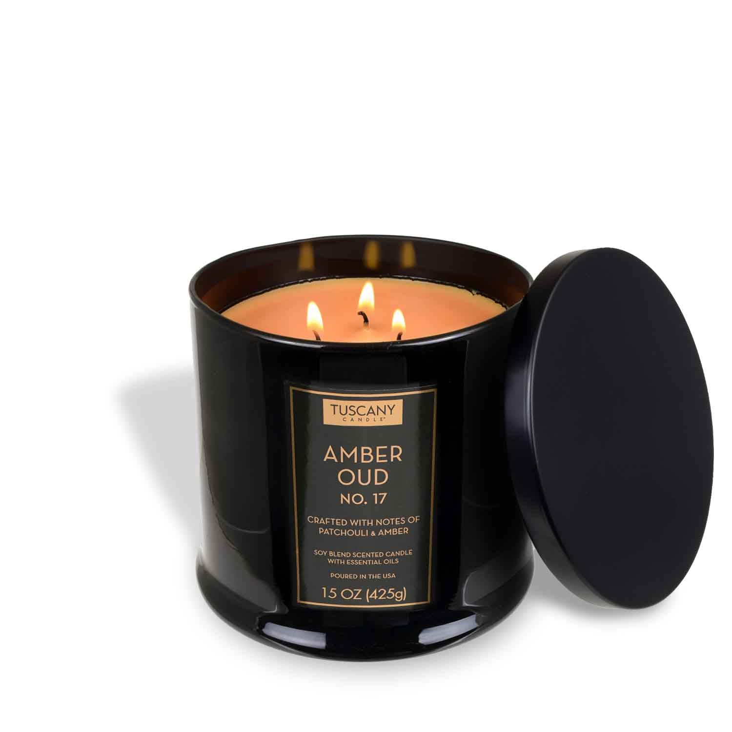 The Tuscany Candle® EVD Amber Oud Scented Jar Candle (15 oz) from the Homme + Heritage Collection features a black glass design with three wicks and a matching lid—a bold, masculine fragrance for any space.