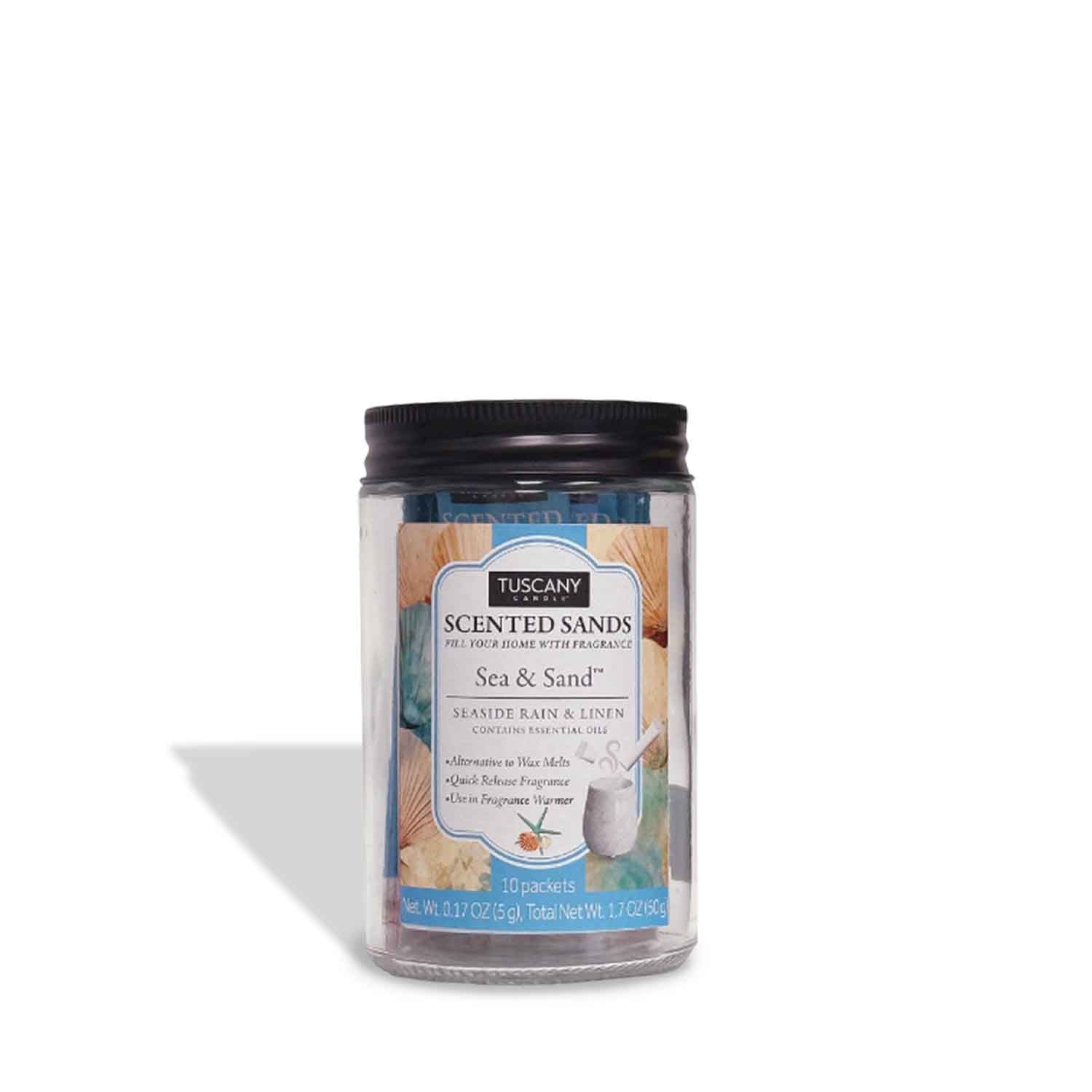 A clear plastic jar of Tuscany Candle® EVD Sea & Sand Scented Sands (10 packets) with a black lid and a beach-themed decorative label.