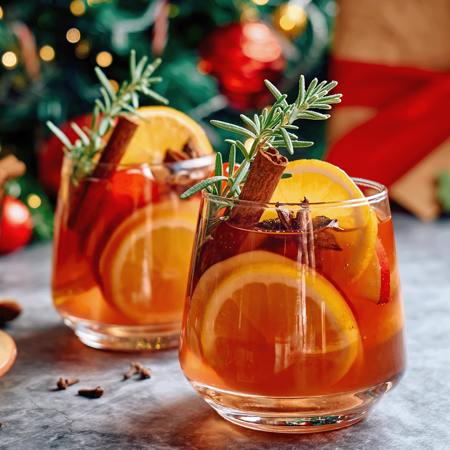 Two warmers of Sparkling Sangria Scented Wax Melt, infused with notes of orange slices, cinnamon sticks, and rosemary by Tuscany Candle® SEASONAL, set against a festive backdrop.