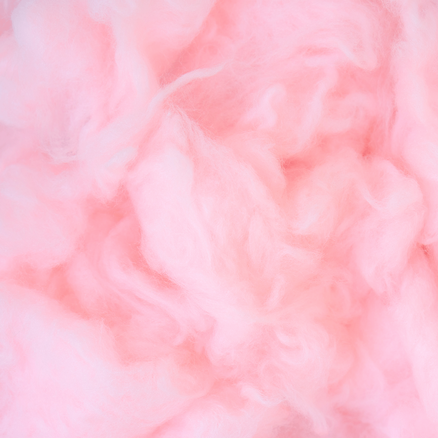 A close-up of the fluffy texture of the Cotton Tails: Raspberry Scented Easter Candle (18 oz) by Tuscany Candle® SEASONAL, with playful hints reminiscent of pink cotton candy and blue raspberry swirls.