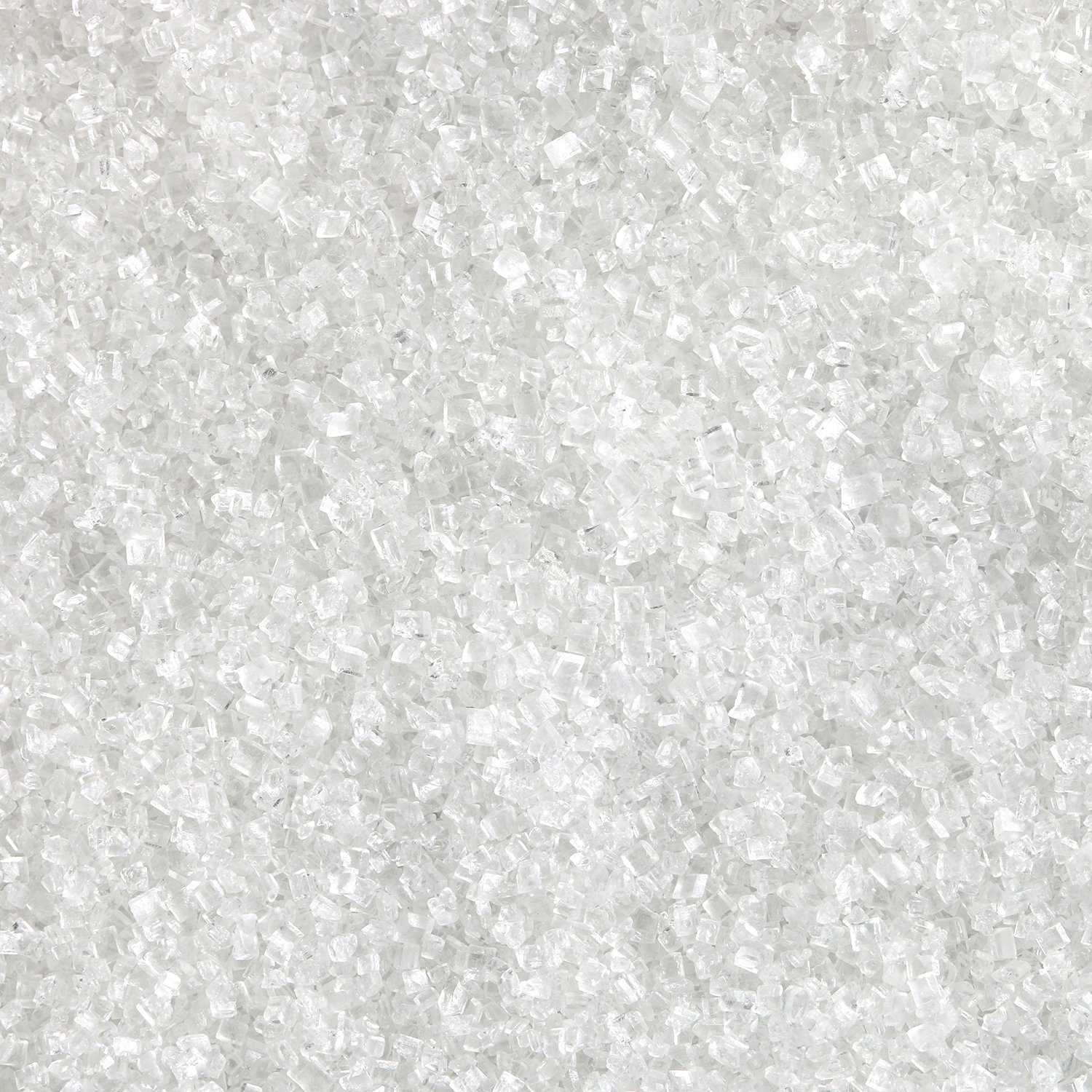 Close-up of granular white sugar crystals, capturing the essence of a Tuscany Candle® SEASONAL Cinnamon Donut: Cinnamon & Sugar Scented Spring Candle (18 oz), spread evenly across the image surface.