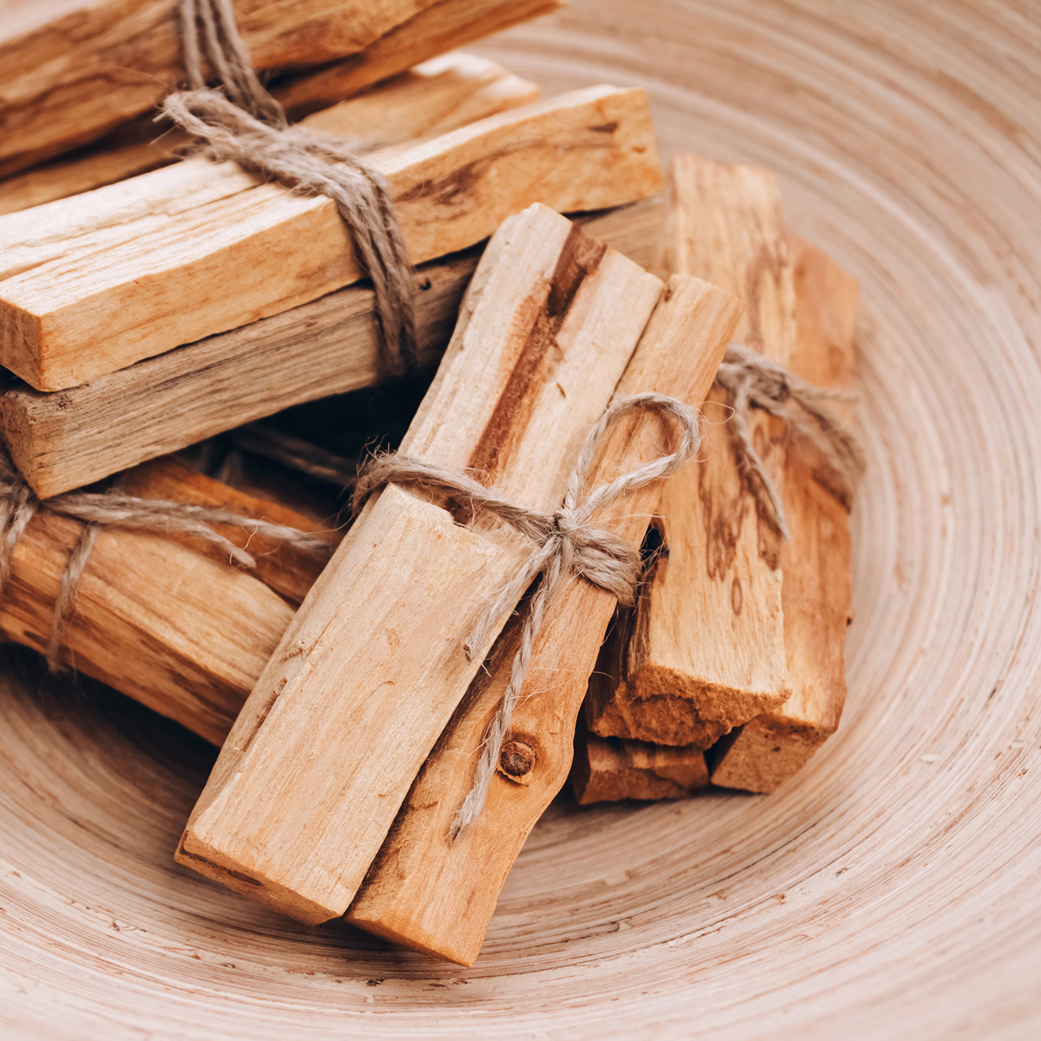 The Sun-Kissed Woods: Palo Santo Scented Summer Candle (18 oz) by Tuscany Candle® SEASONAL features warm, woody aromas inspired by palo santo, perfect for infusing any space with a cozy, summer vibe.
