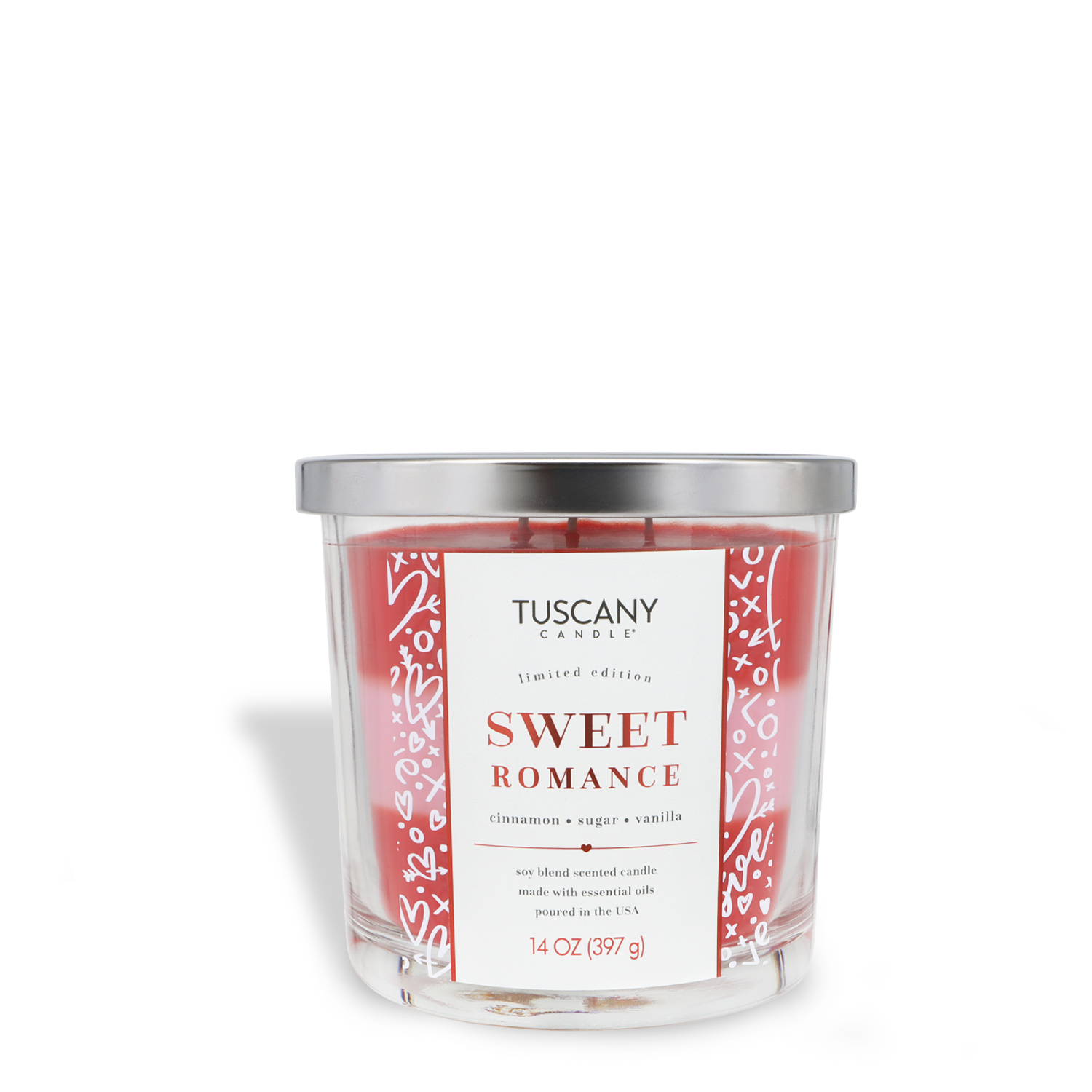 The Tuscany Candle® SEASONAL Sweet Romance: Cinnamon & Sugar Scented Valentine's Candle (14 oz) comes in a clear glass jar with a silver lid and features cozy cinnamon, sugar, and vanilla scents.