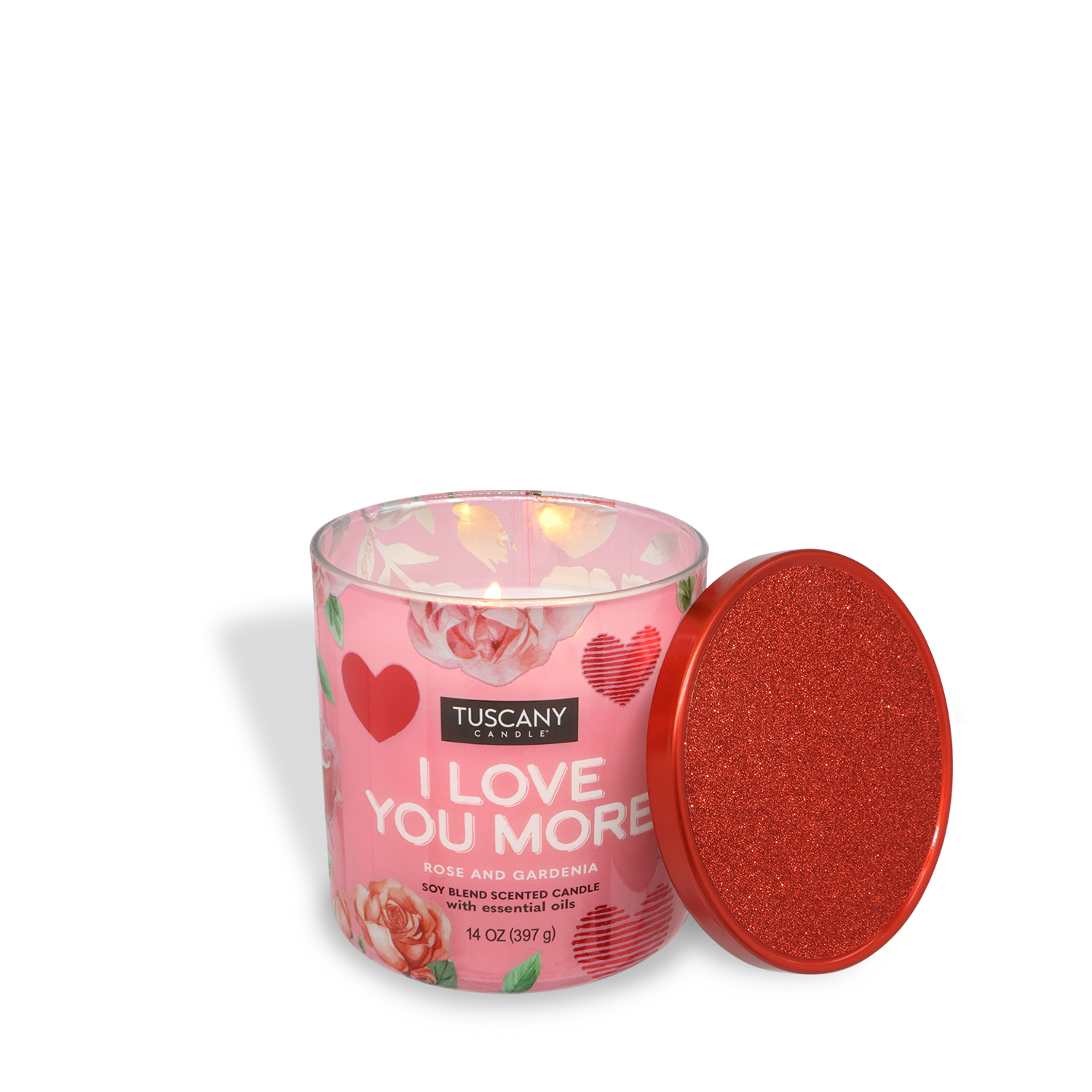 The Tuscany Candle® SEASONAL "I Love You More" Valentine's Candle (14 oz) features a rose & gardenia scent, pink jar with heart designs, and comes with a red glitter lid placed to the side.