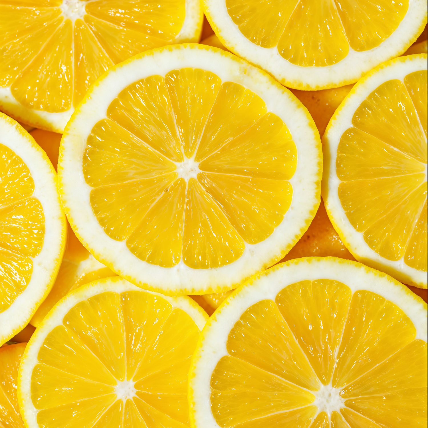 Several yellow lemon slices are overlapped, revealing juicy interiors and white rind—an ideal inspiration for the Tuscany Candle® EVD Sweet Tea Scented Jar Candle (10 oz), part of the Farmhouse Collection.