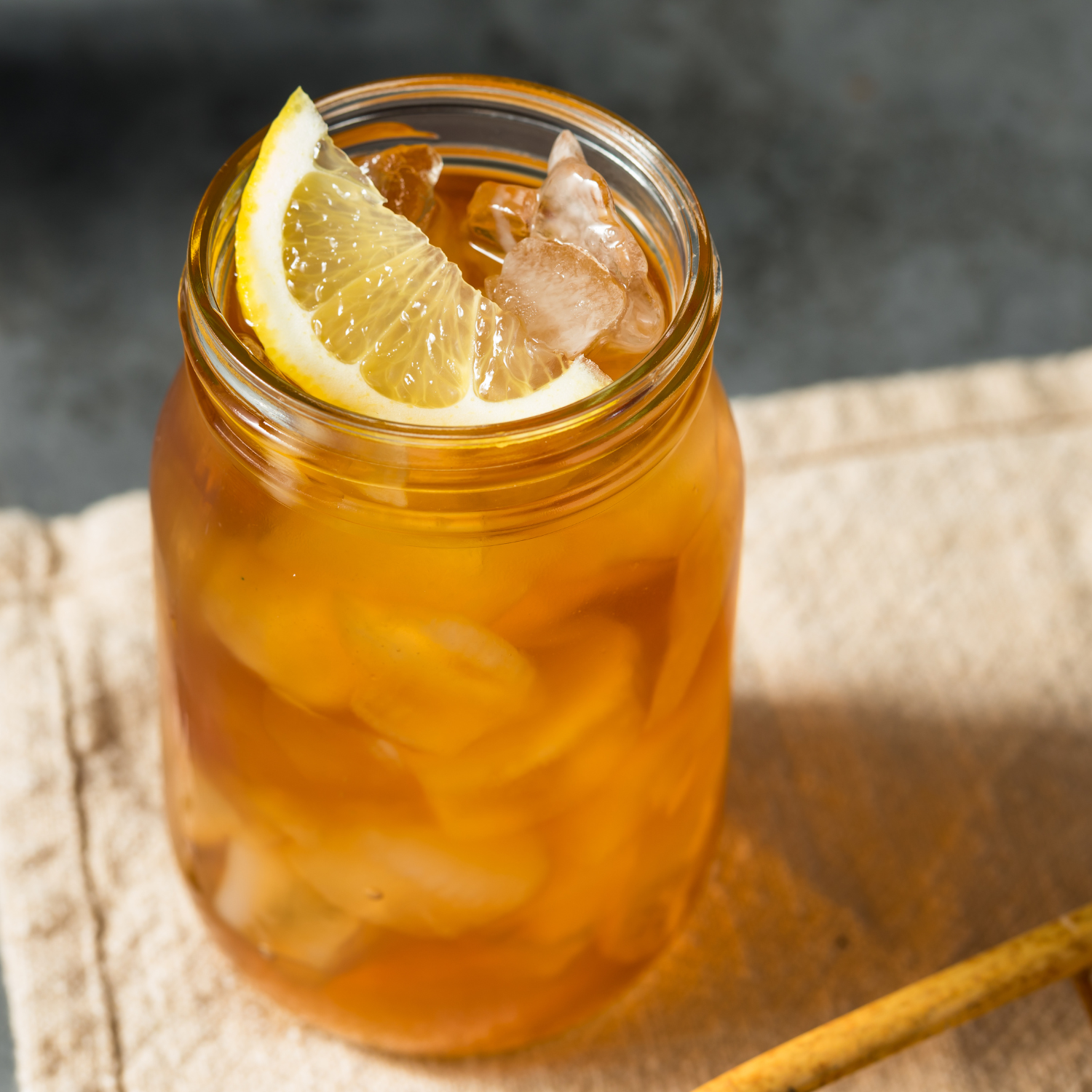 The Tuscany Candle® EVD Sweet Tea Scented Jar Candle (10 oz) from the Farmhouse Collection evokes classic sweet tea with lemon and ice, making it a charming farmhouse accent for your home.