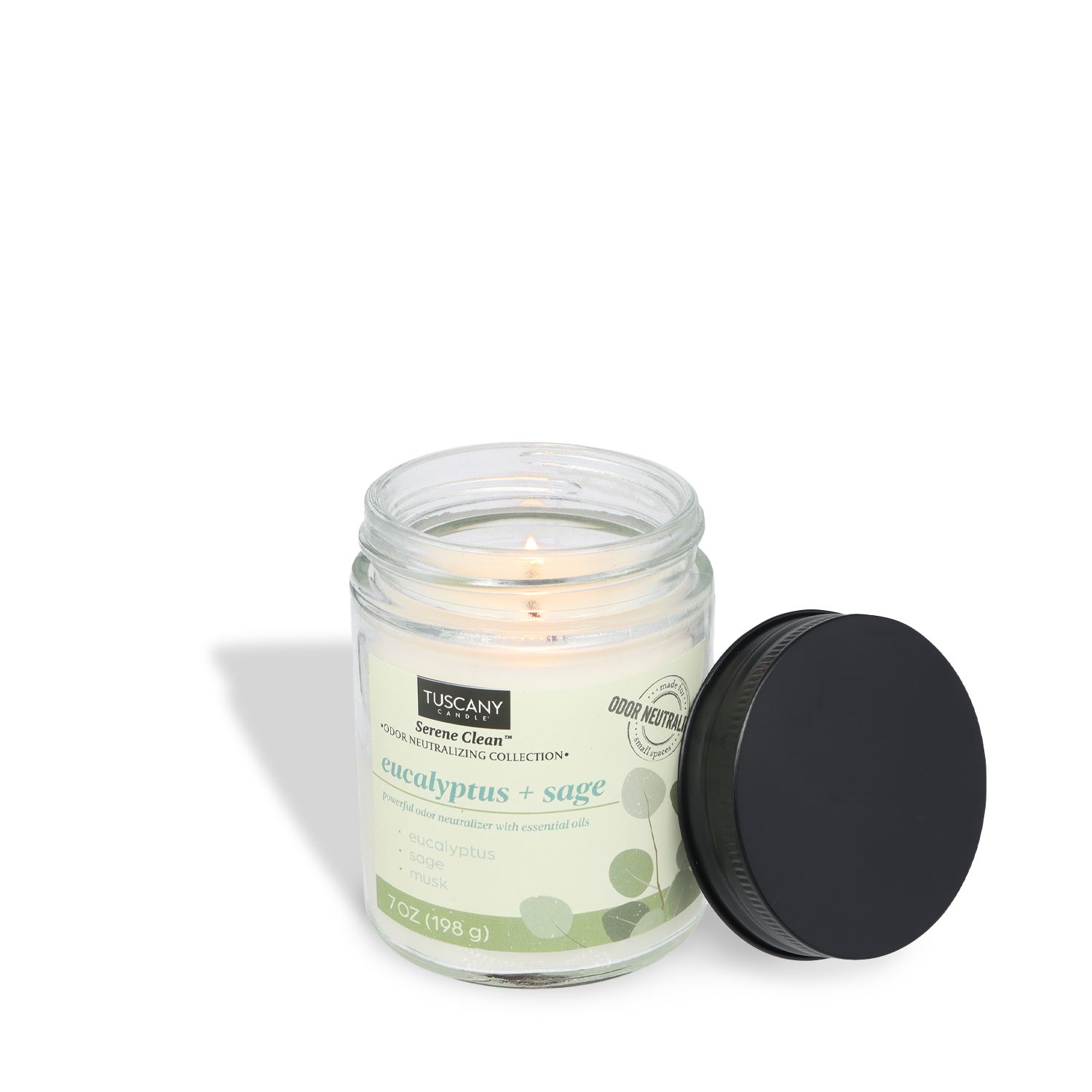 The Tuscany Candle® Everyday Eucalyptus + Sage Scented Odor Neutralizing Candle (7 oz), from the Serene Clean Collection, sits lit in its glass jar with a black lid beside it, infusing the air with a refreshing aroma against a white background.