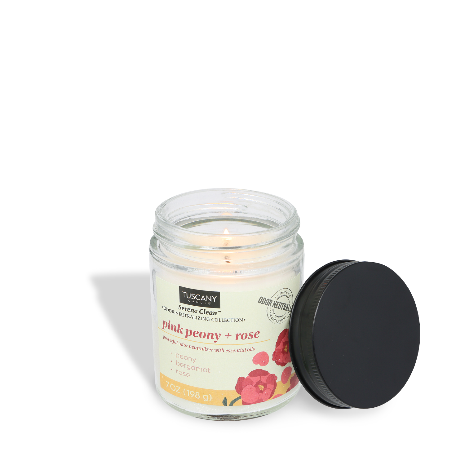 An open Tuscany Candle® Everyday Pink Peony + Rose Scented Odor Neutralizing Candle (7 oz) from the Serene Clean Collection, with its black lid nearby; the lit candle's floral-scented label features elegant flower graphics.
