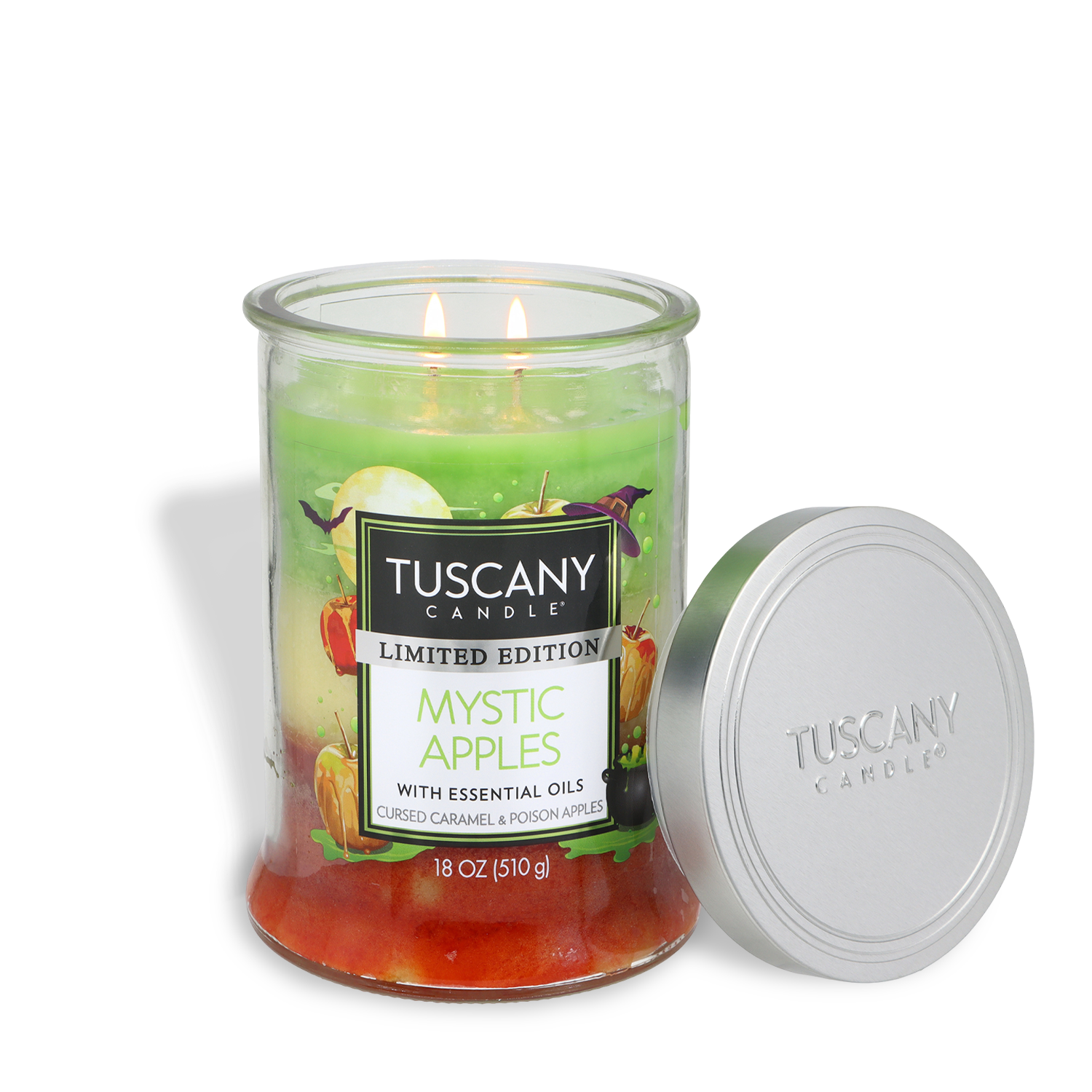 A Tuscany Candle® SEASONAL jar labeled “Mystic Apples: Caramel & Poison Apples Scented Halloween Candle (18 oz)” with a silver lid sits beside it. The candle is green and red, and its label features images of apples.