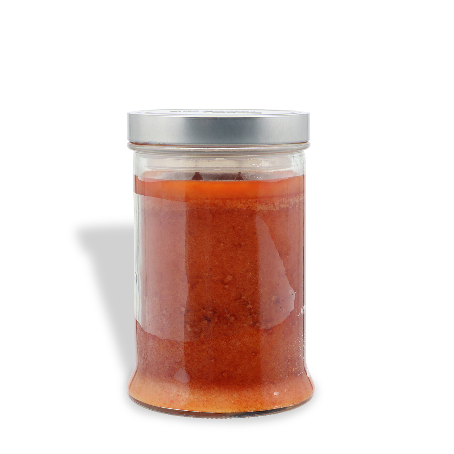 A glass jar labeled “Charmed Pumpkin: Spooky Spice & Pumpkin Scented Halloween Candle” from Tuscany Candle® SEASONAL, filled with an orange candle and sealed with a silver metal lid, is placed against a white background.