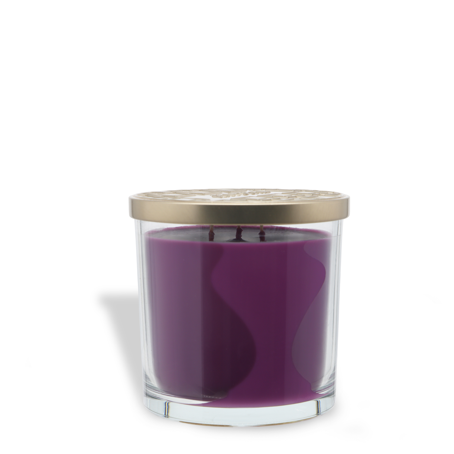 A clear glass jar with a gold metal lid holds the Tuscany Candle® SEASONAL Booquet Berries: Blackberry & Cassis Scented Halloween Candle (14 oz), featuring a purple, three-wick candle inside.