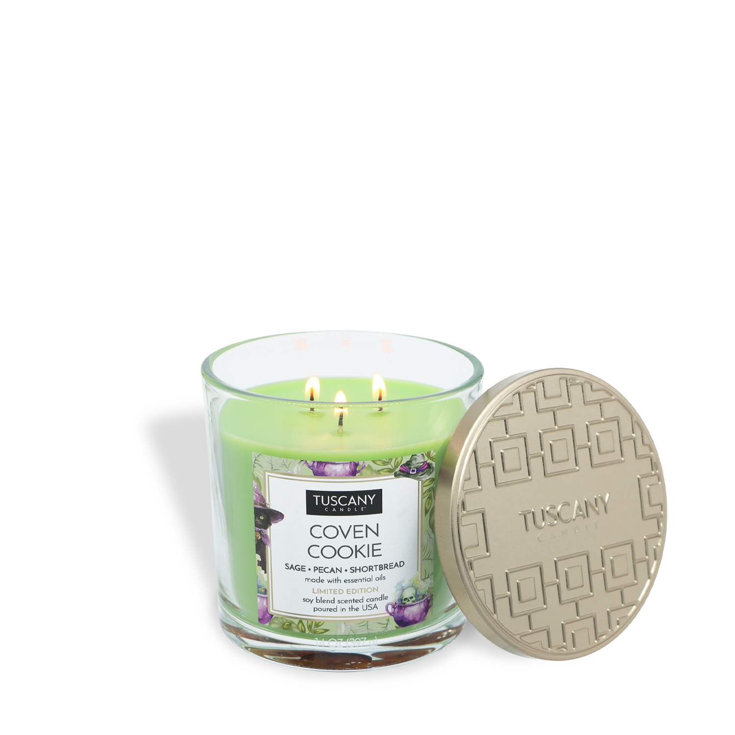 The Tuscany Candle® SEASONAL “Coven Cookie: Pecan Shortbread Scented Halloween Candle” (14 oz), featuring a sage, pecan, and shortbread aroma, is presented in a green glass jar with three wicks and comes with a gold-colored lid embossed with a geometric pattern.