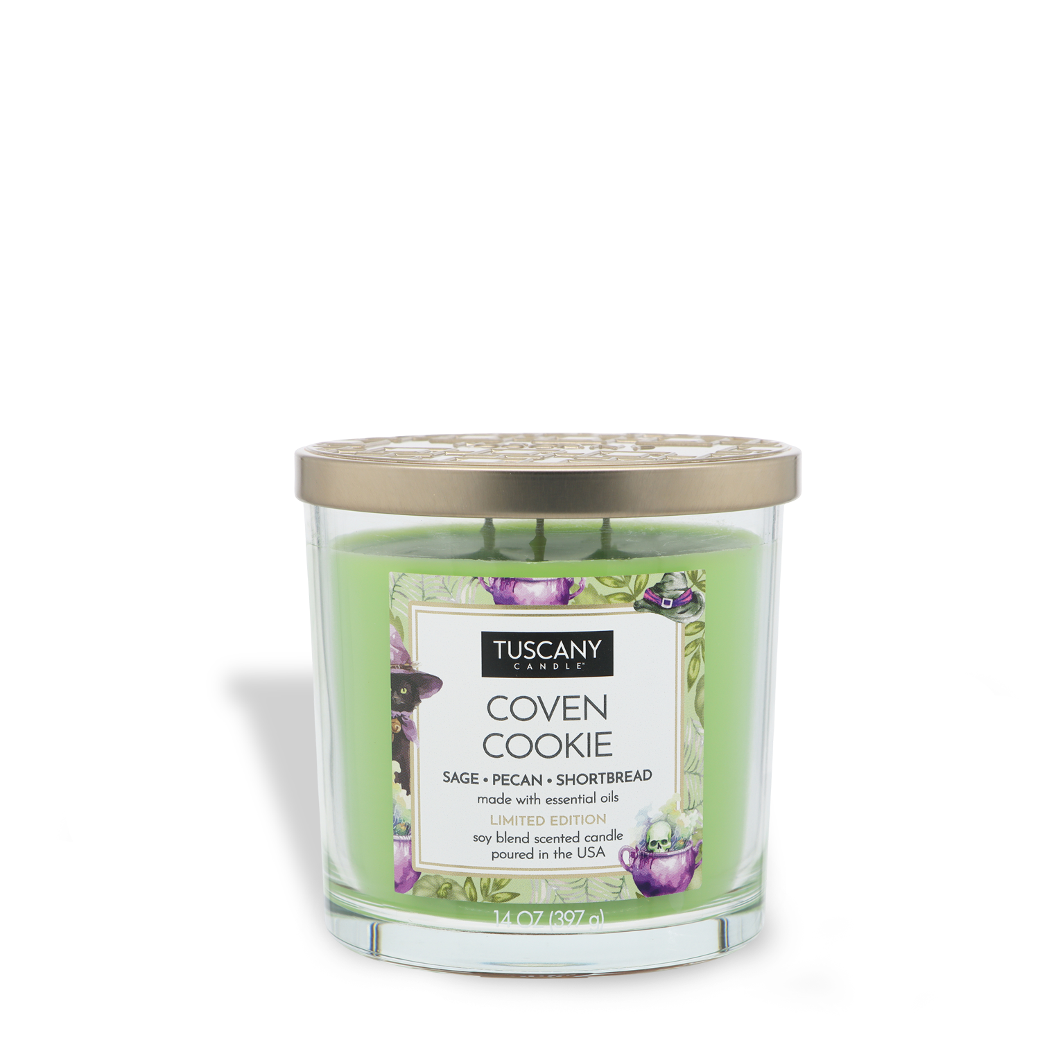 A 14 oz glass jar Halloween candle labeled “Coven Cookie: Pecan Shortbread Scented” from Tuscany Candle® SEASONAL, featuring green wax, a gold lid, and a label decorated with images of cookies and herbs.