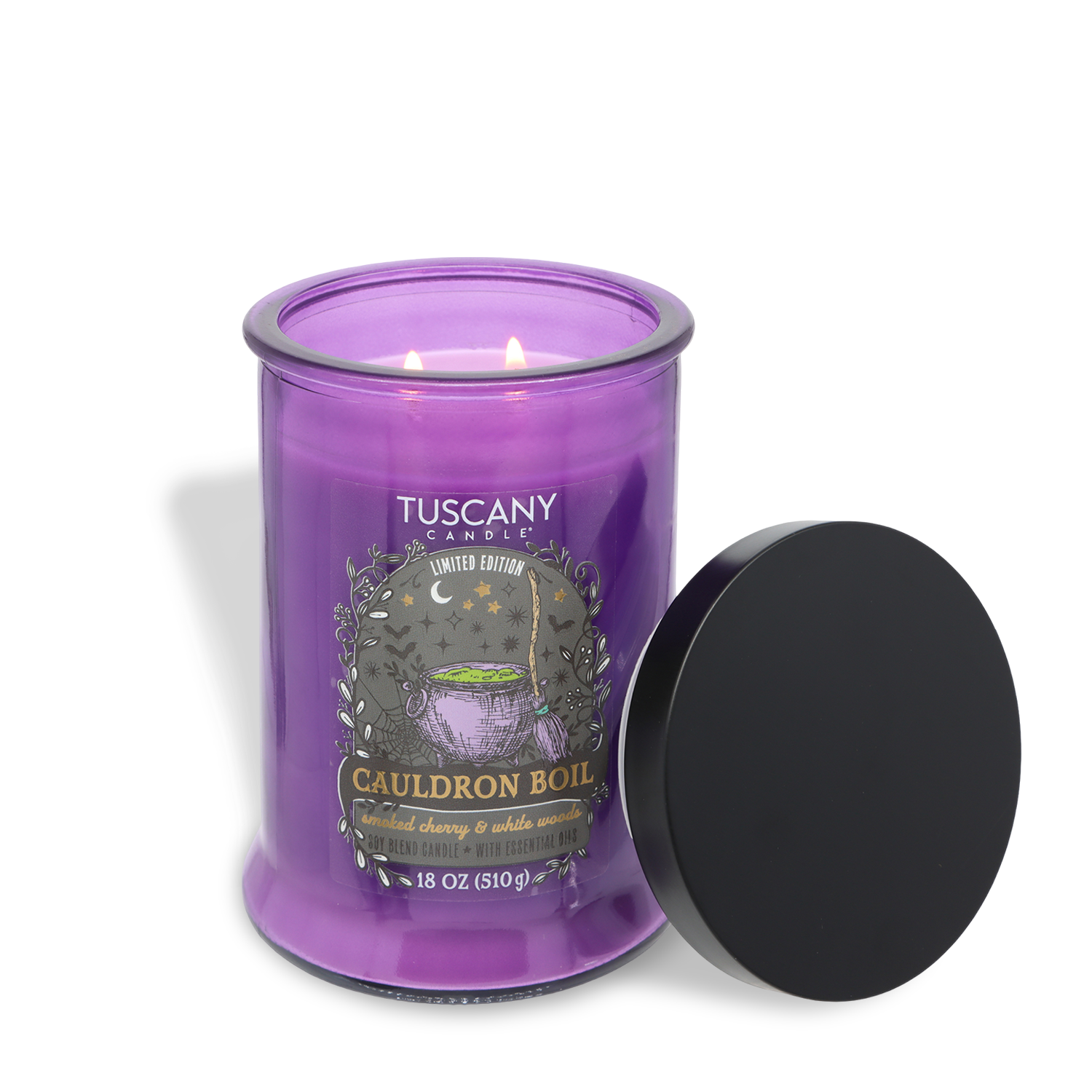 A Tuscany Candle® SEASONAL “Cauldron Boil: Smoked Cherry & White Woods” scented Halloween candle (18 oz) with a purple hue features two lit wicks and has its black lid resting nearby.