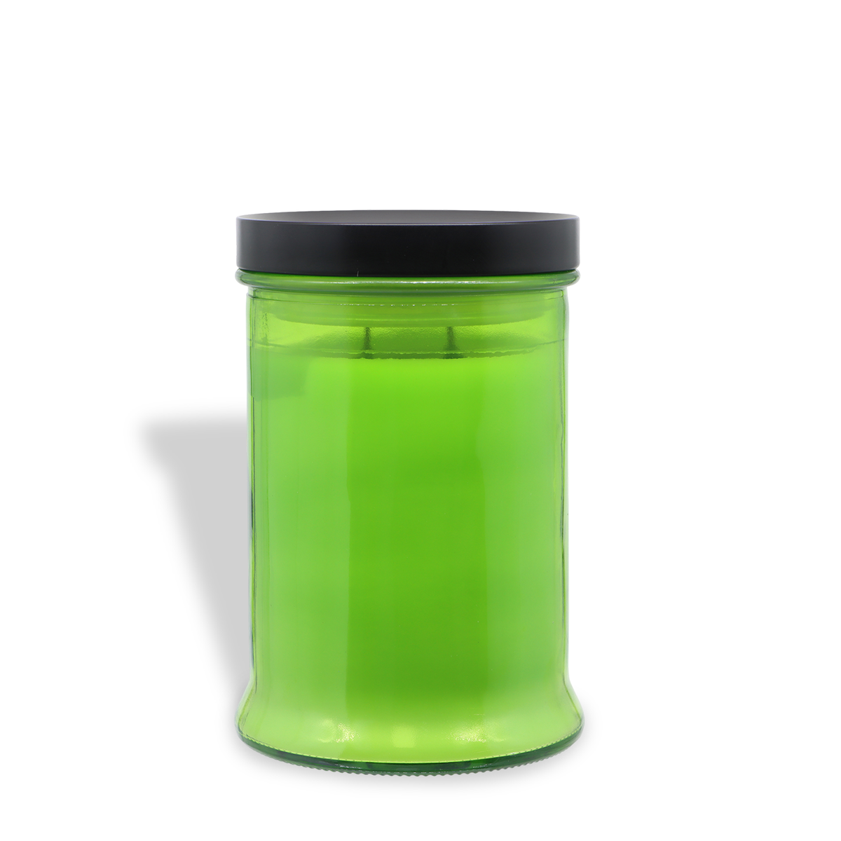 A Tuscany Candle® SEASONAL Graveyard Fog: Twilight Amber, Sage & Oak Scented Halloween Candle (18 oz) in a green hue is displayed in a clear glass jar with a black lid, photographed against a white background.