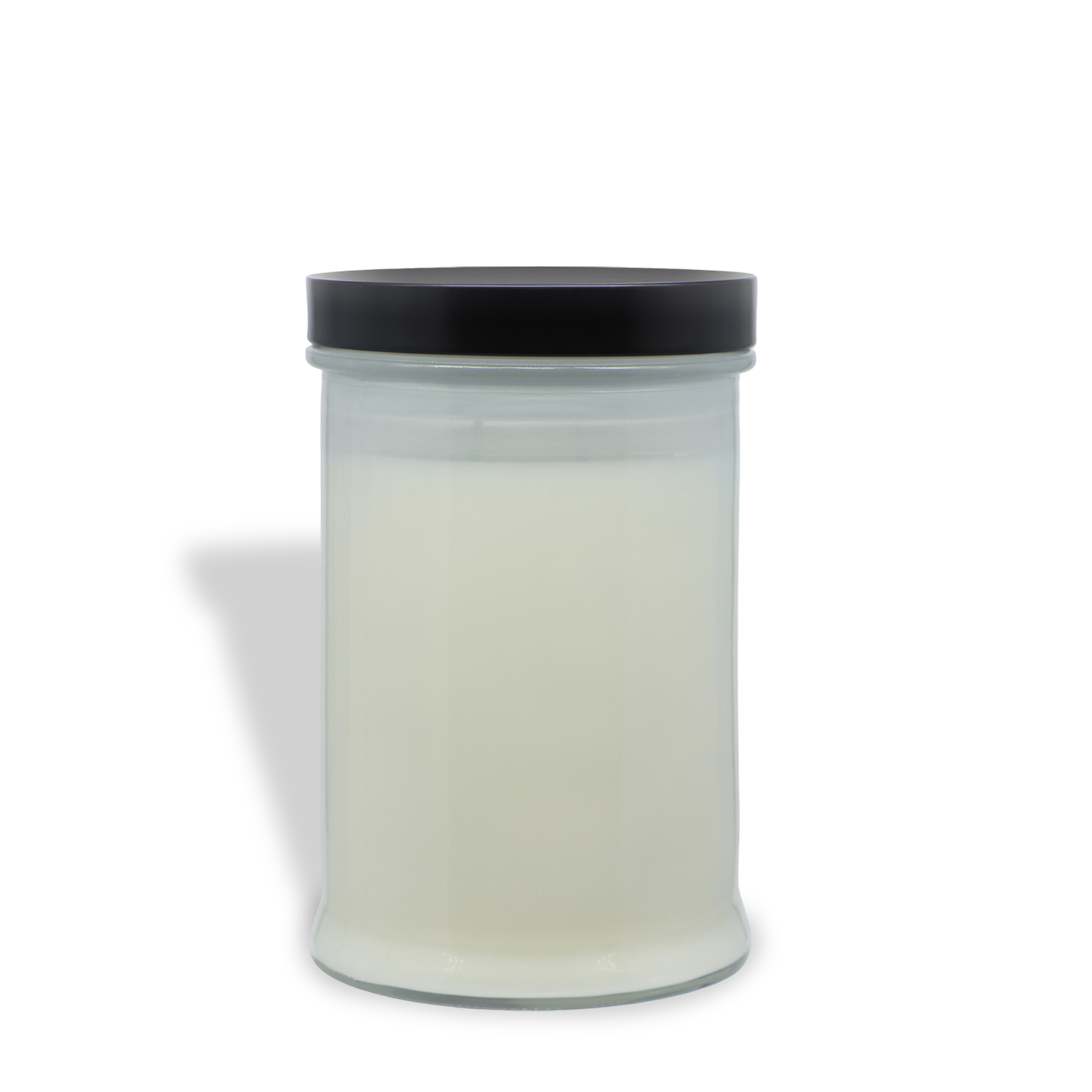 An 18 oz Ghost Stories: Leatherbound Book Scented Halloween Candle by Tuscany Candle® SEASONAL, featuring white wax in a clear glass jar sealed with a black screw-on lid, is displayed against a white background.