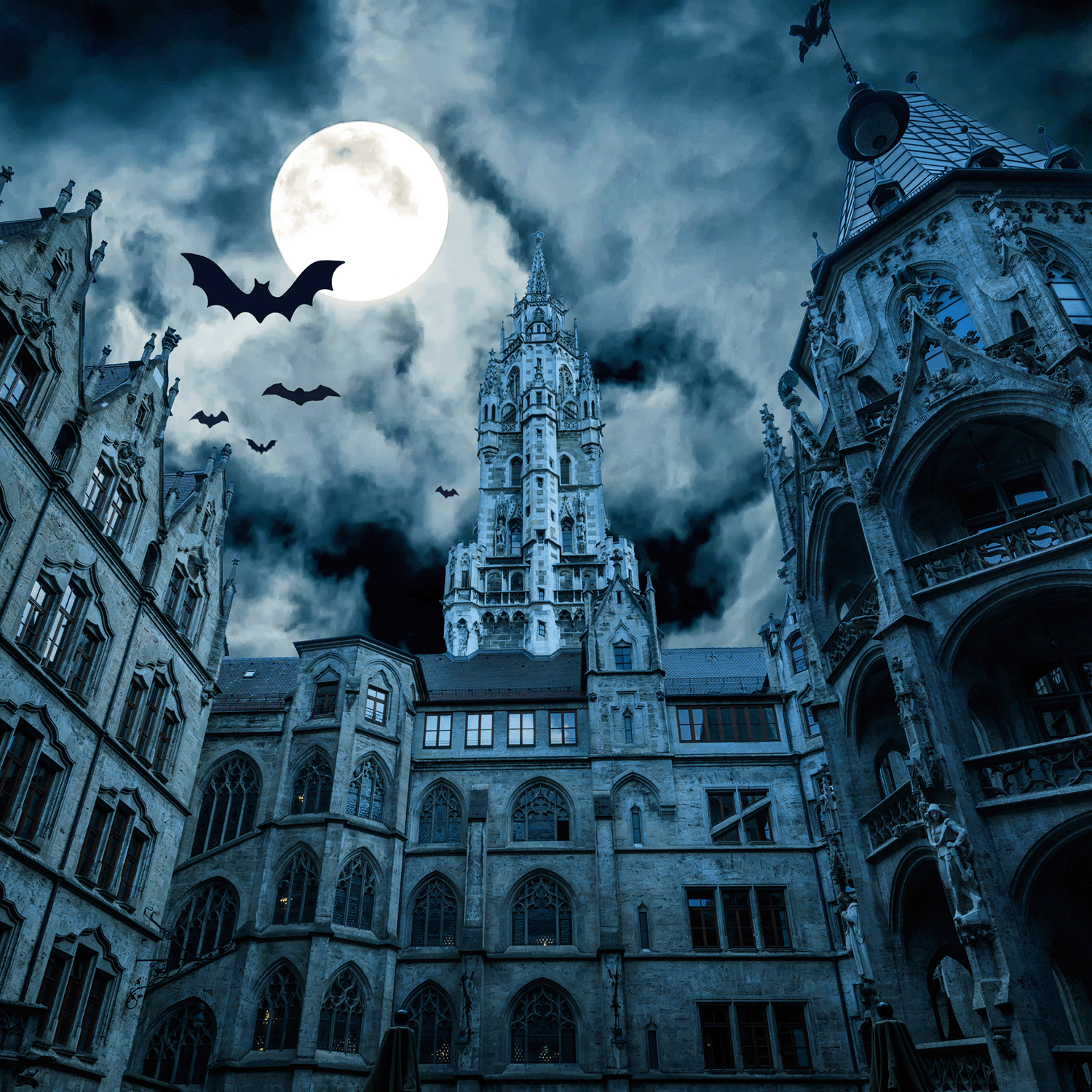 A Gothic-style castle under a full moon, shrouded in clouds and with bats soaring through the night sky, captures the haunting allure of Tuscany Candle® SEASONAL’s Fright Night: Wicked Berry Bite Scented Halloween Candle (14 oz).