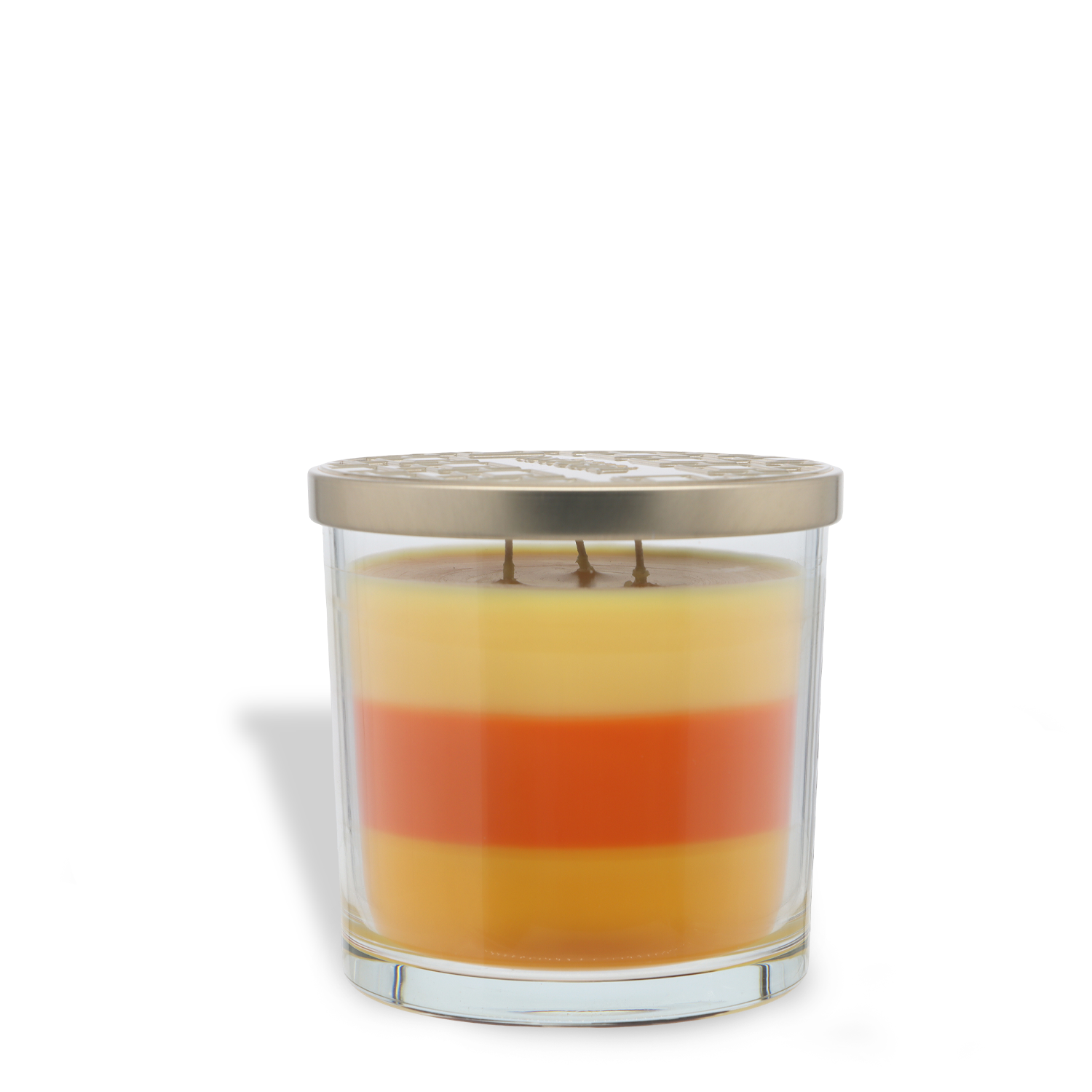 The Tuscany Candle® SEASONAL Pumpkin Farm: Cedar & Cinnamon Scented Fall Candle (14 oz) features a glass jar with three horizontal wax layers—yellow, orange, and cream—three wicks, and a metal lid.