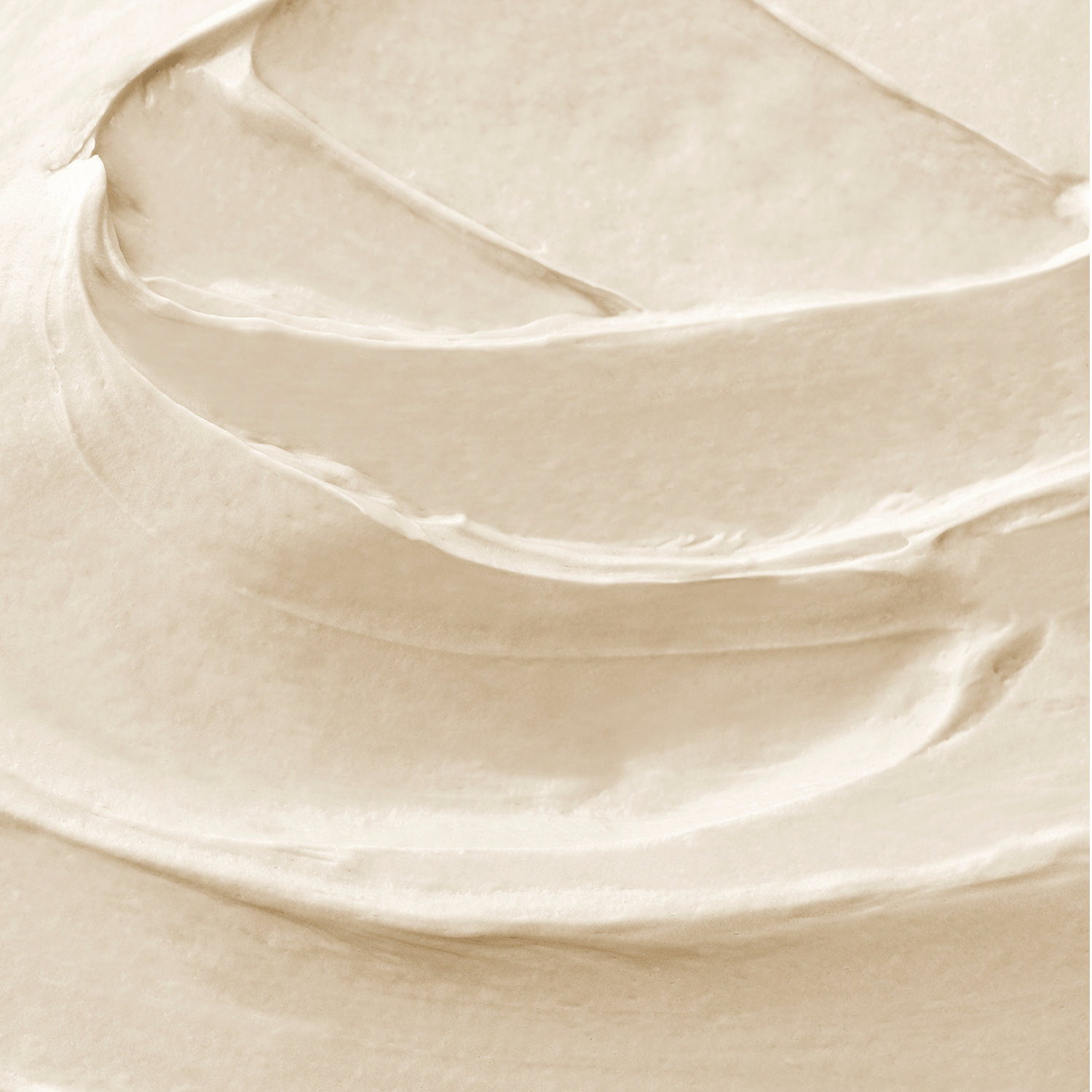 A close-up of the creamy, softly swirled surface of Tuscany Candle® SEASONAL’s Whipped Vanilla: Butterscotch & Cream Scented Fall Candle (14 oz) captures its inviting, whipped vanilla appearance—perfect for filling any room with a cozy butterscotch and cream home fragrance.