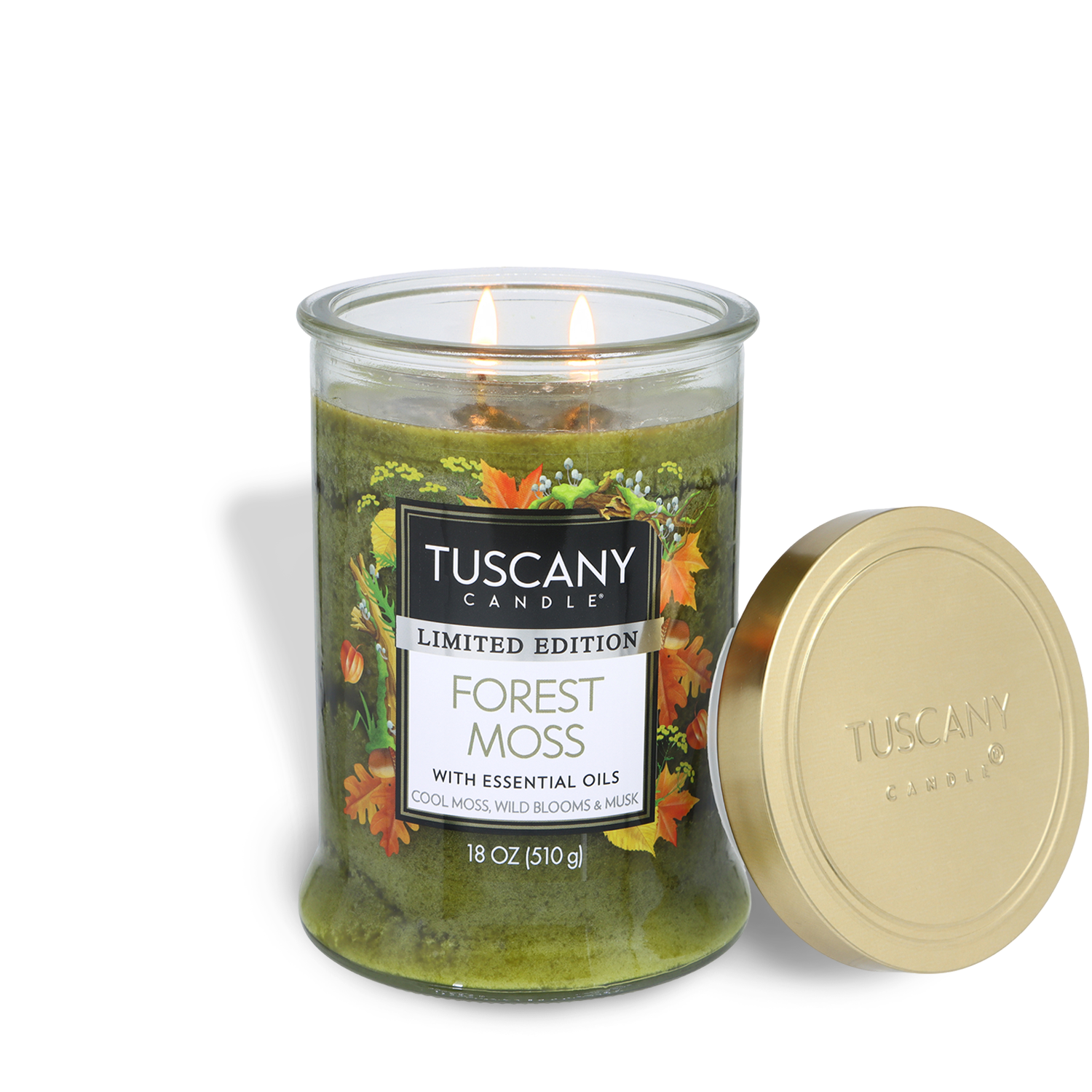 A Tuscany Candle® SEASONAL "Forest Moss: Wild Blooms & Musk" fall candle (18 oz) features a green glass jar with two lit wicks and a gold lid set beside it.