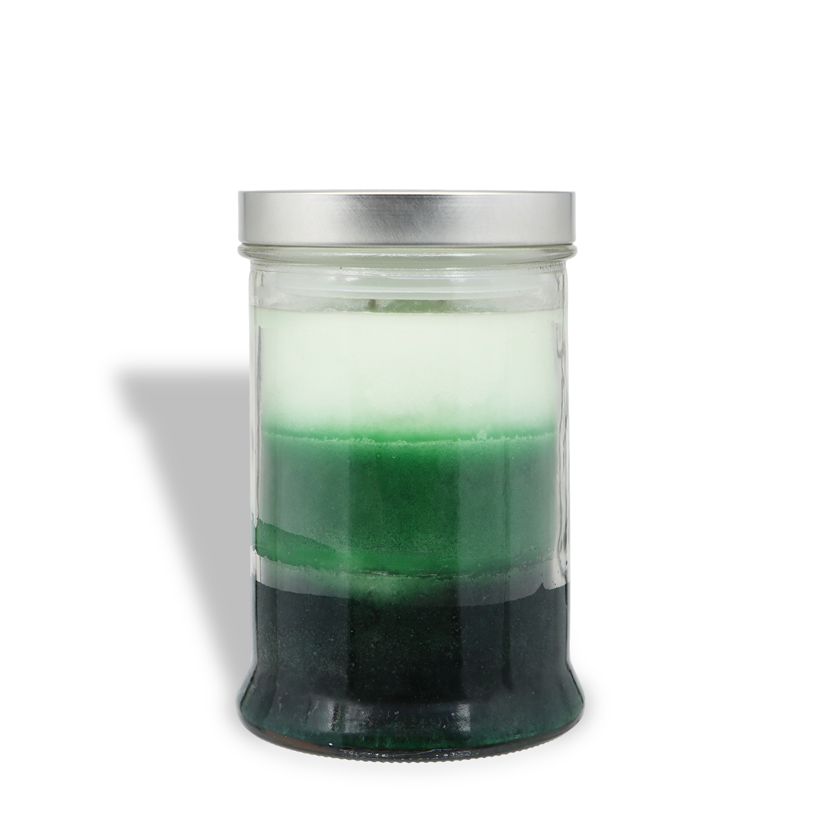 Tuscany Candle® SEASONAL Evergreen Cheer: Fresh Citrus & Patchouli Scented Holiday Candle in a glass jar with layers of white, light green, and dark green wax, topped with a silver lid.