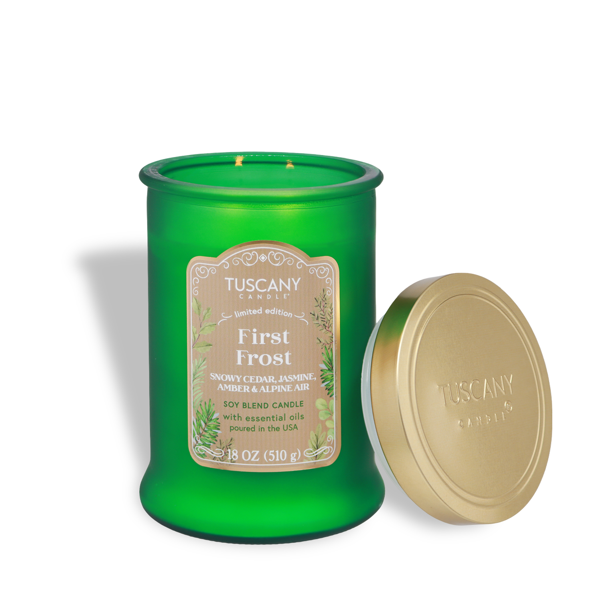 Tuscany Candle® SEASONAL First Frost: Jasmine & Cedar Scented Holiday Candle (18 oz) in a green glass jar with an open lid.