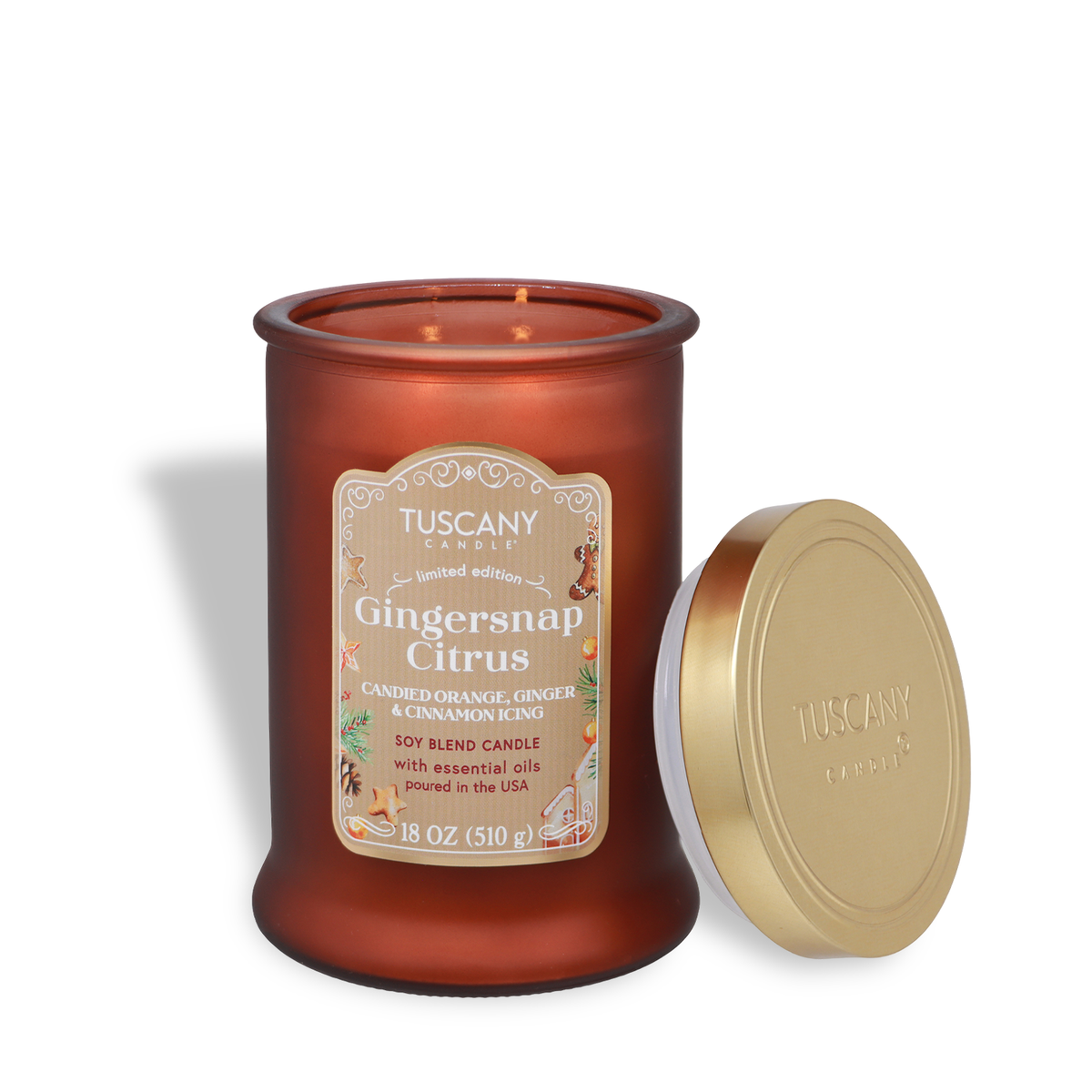 An 18-ounce Tuscany Candle® SEASONAL Gingersnap Citrus: Candied Orange & Cinnamon Scented Holiday Candle in a burnt orange glass jar with its gold lid removed.