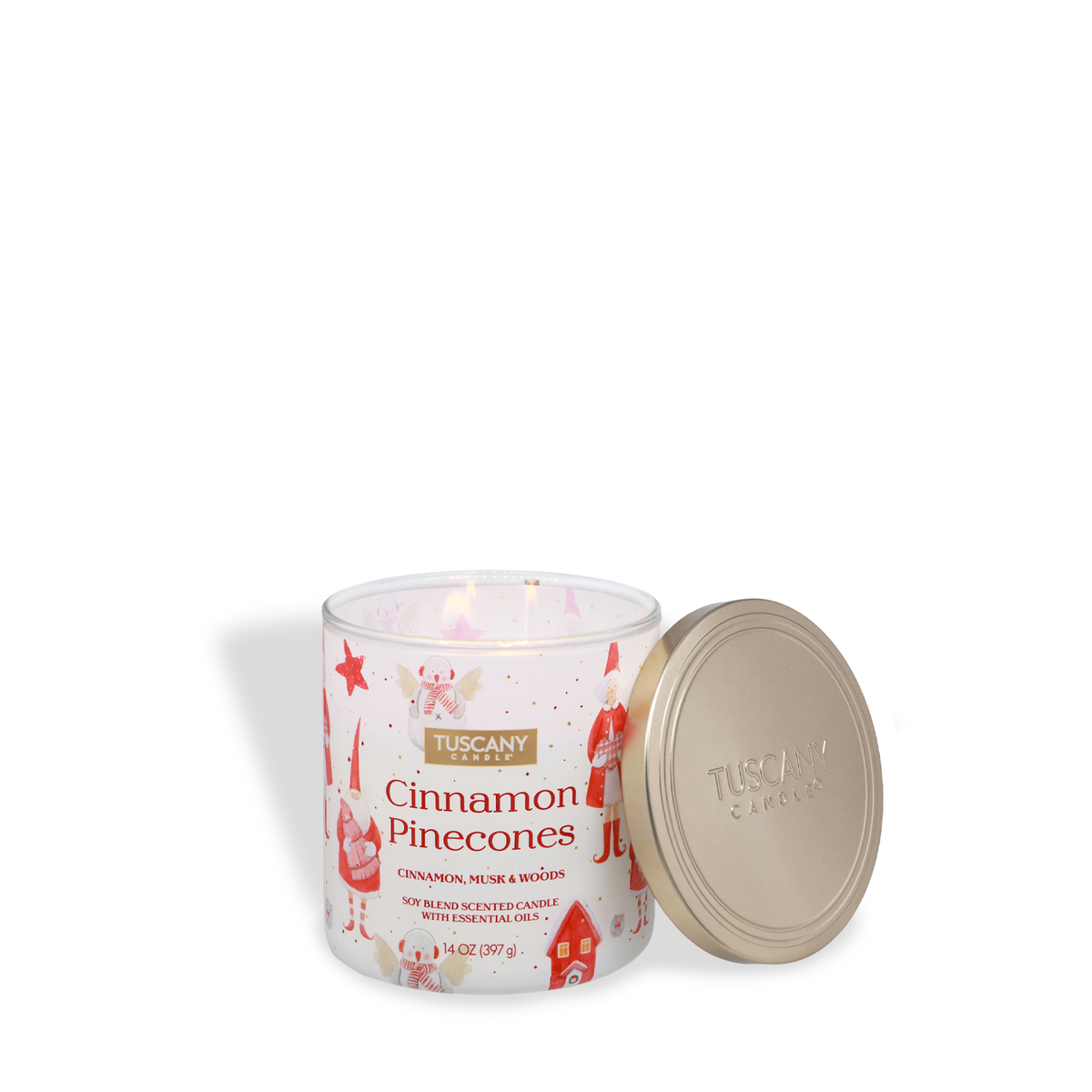 A 14 oz Tuscany Candle® SEASONAL Cinnamon Pinecones: Cinnamon & Musk Scented Holiday Candle in a glass jar with a gold lid, decorated with illustrations of gnomes and holiday motifs.
