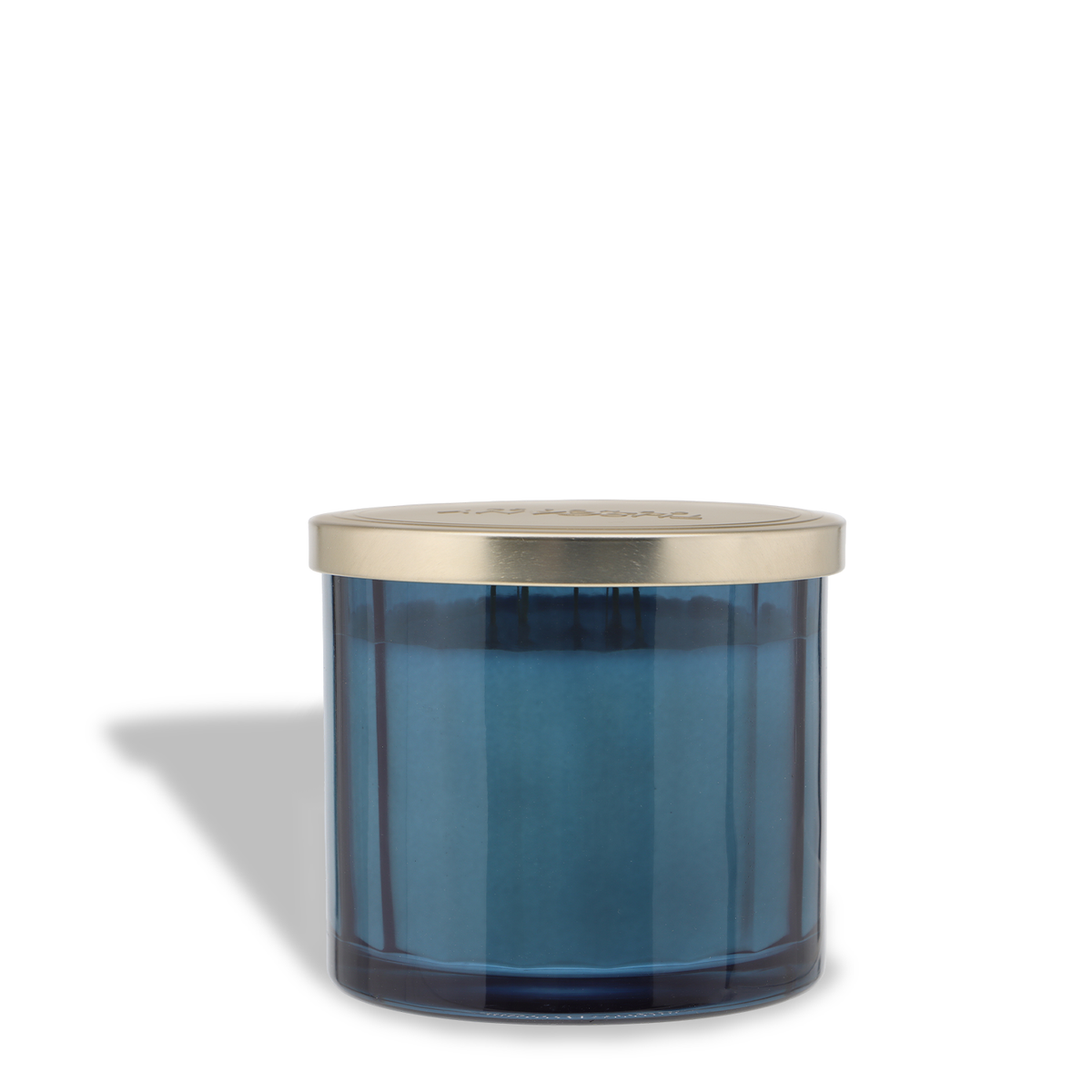 Blue glass Sleigh Ride: Golden Amber & Oak Scented Holiday Candle (12.5 oz) with a gold-toned lid.