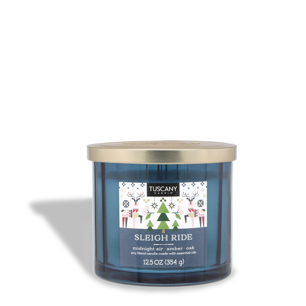A blue three-wick Tuscany Candle® SEASONAL Sleigh Ride: Golden Amber & Oak Scented Holiday Candle (12.5 oz) in a glass jar with a gold lid, featuring a label with festive reindeer and tree illustrations.