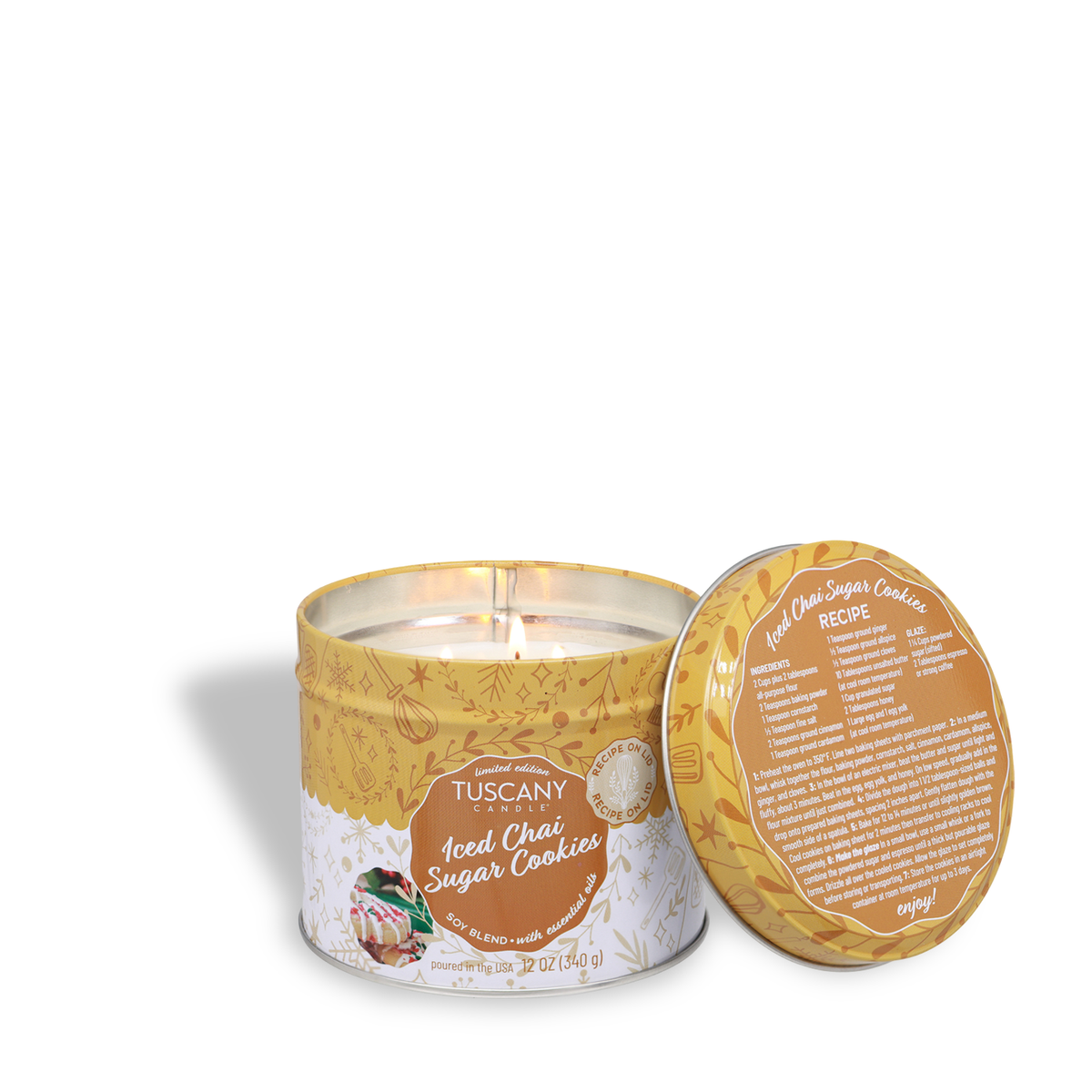 Tuscany Candle® SEASONAL Iced Chai Sugar Cookies: Vanilla & Buttercream Scented Holiday Candle (12 oz) in a gold tin with a lid featuring a printed recipe for iced chai sugar cookies.