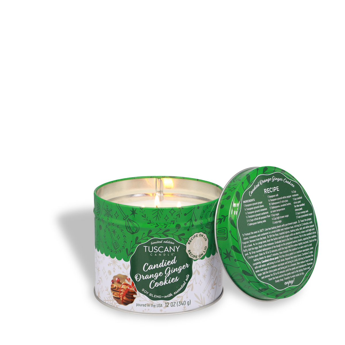 Tuscany Candle® SEASONAL Candied Orange Ginger Cookies Scented Holiday Candle (12 oz) in a green tin with a matching lid displaying a cookie recipe.